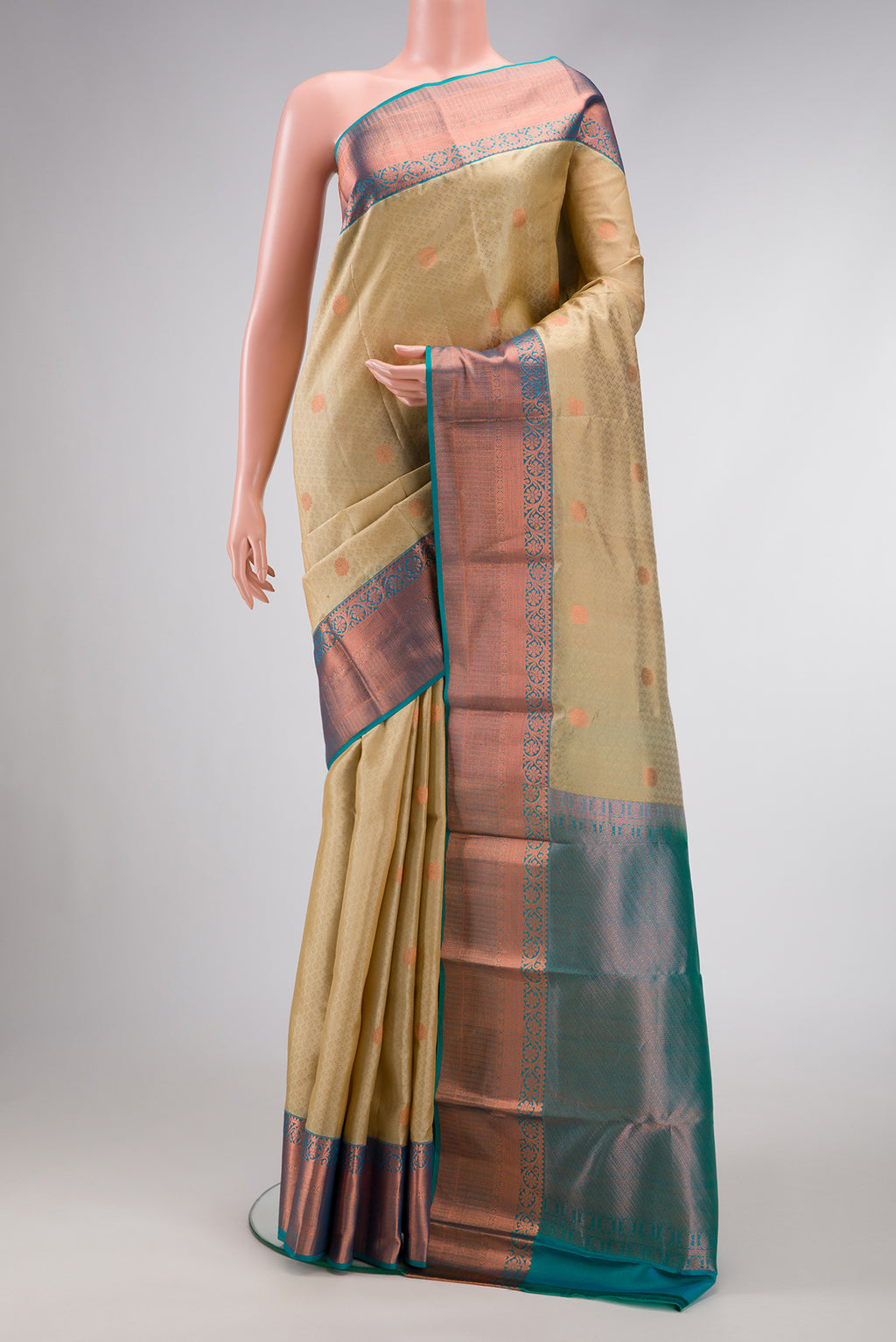 Beige Dual Tone Kanchipuram Silk Saree with Jacquard With Zari Butta on the body and Zari Border.  displayed on a mannequin