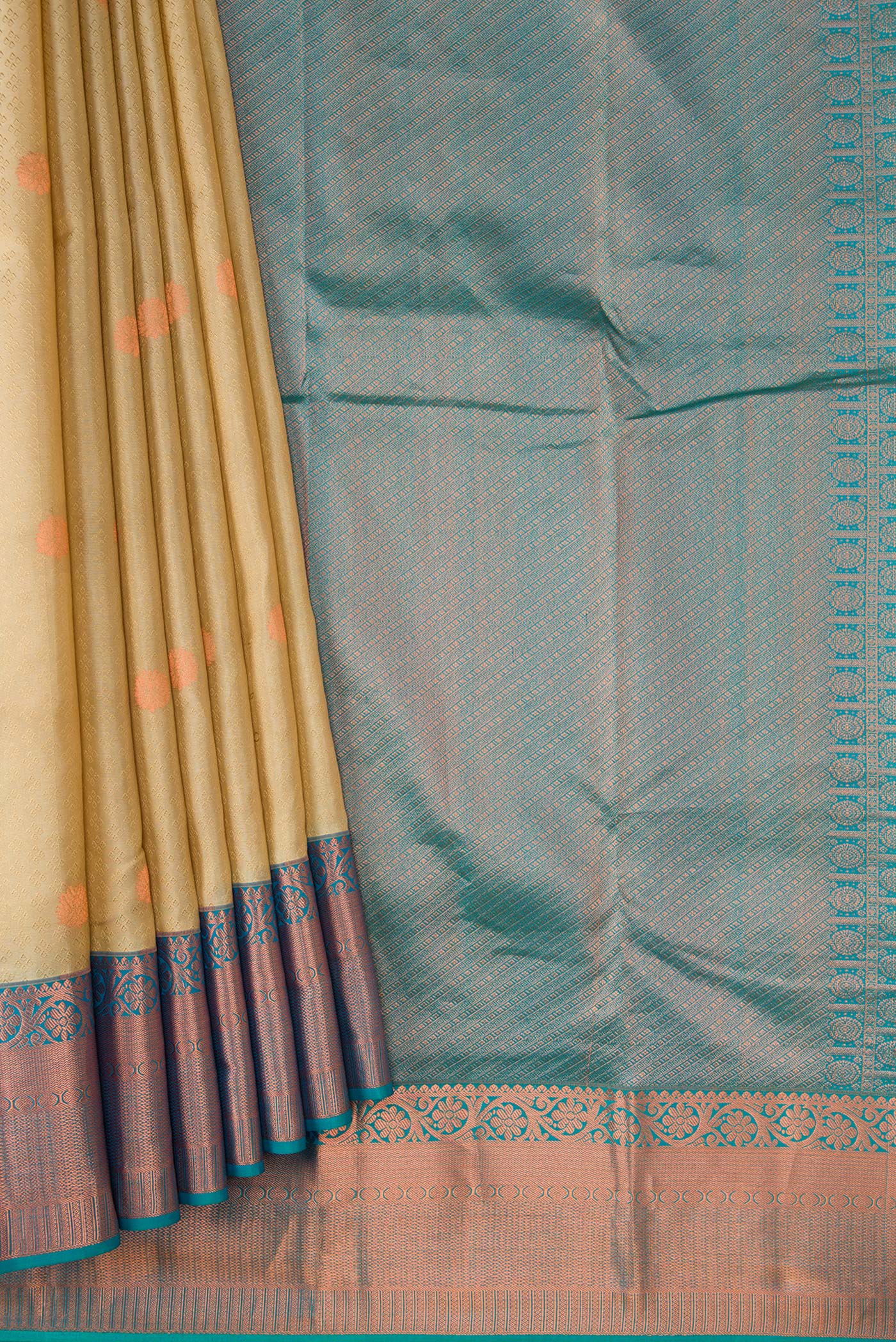 Pleats and pallu of Beige Dual Tone Kanchipuram Silk Saree with Jacquard With Zari Butta on the body and Zari Border. 