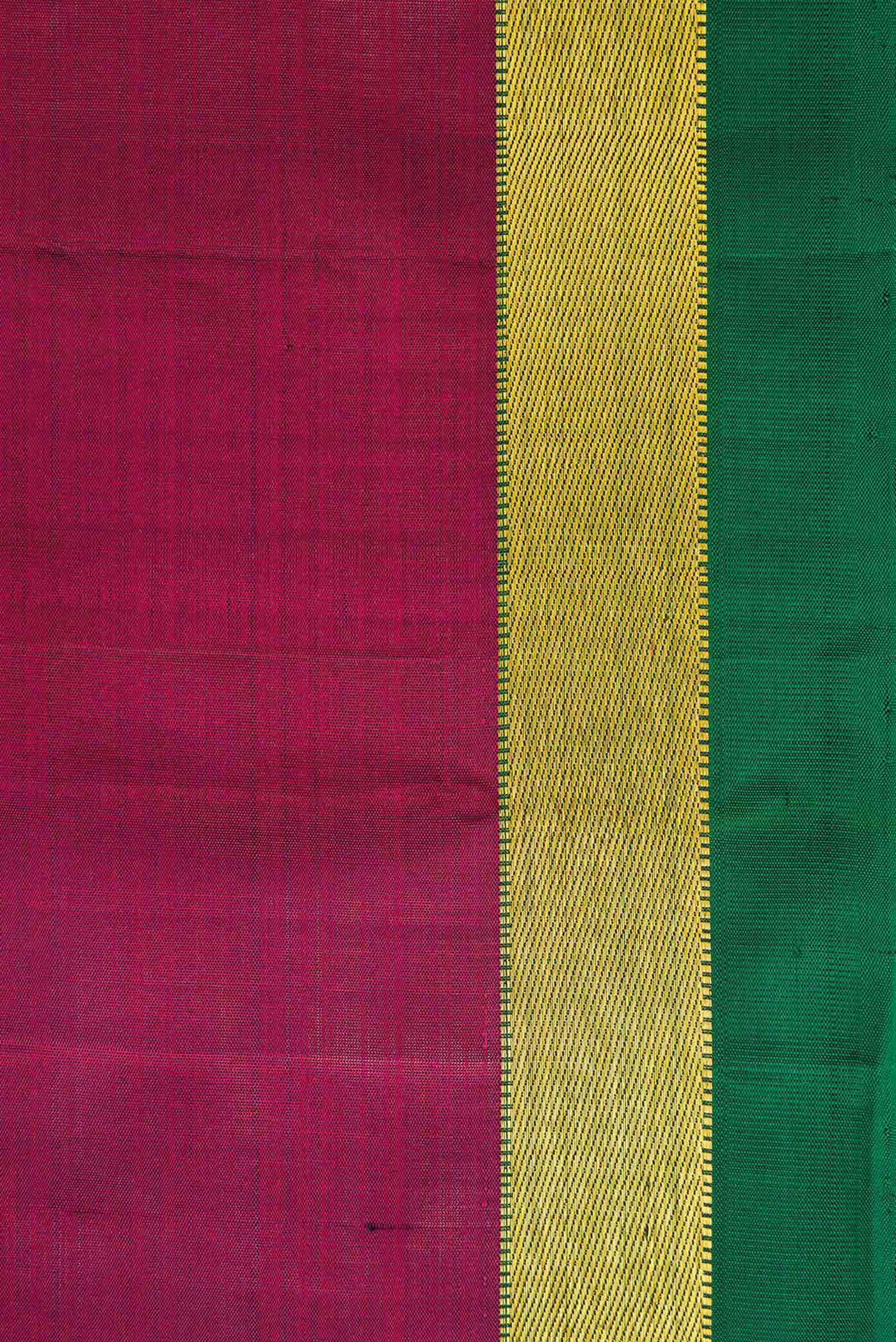 Border image of Maroon Dual Tone Kanjivaram Silk Saree with Plain Body and Zari Border. 
