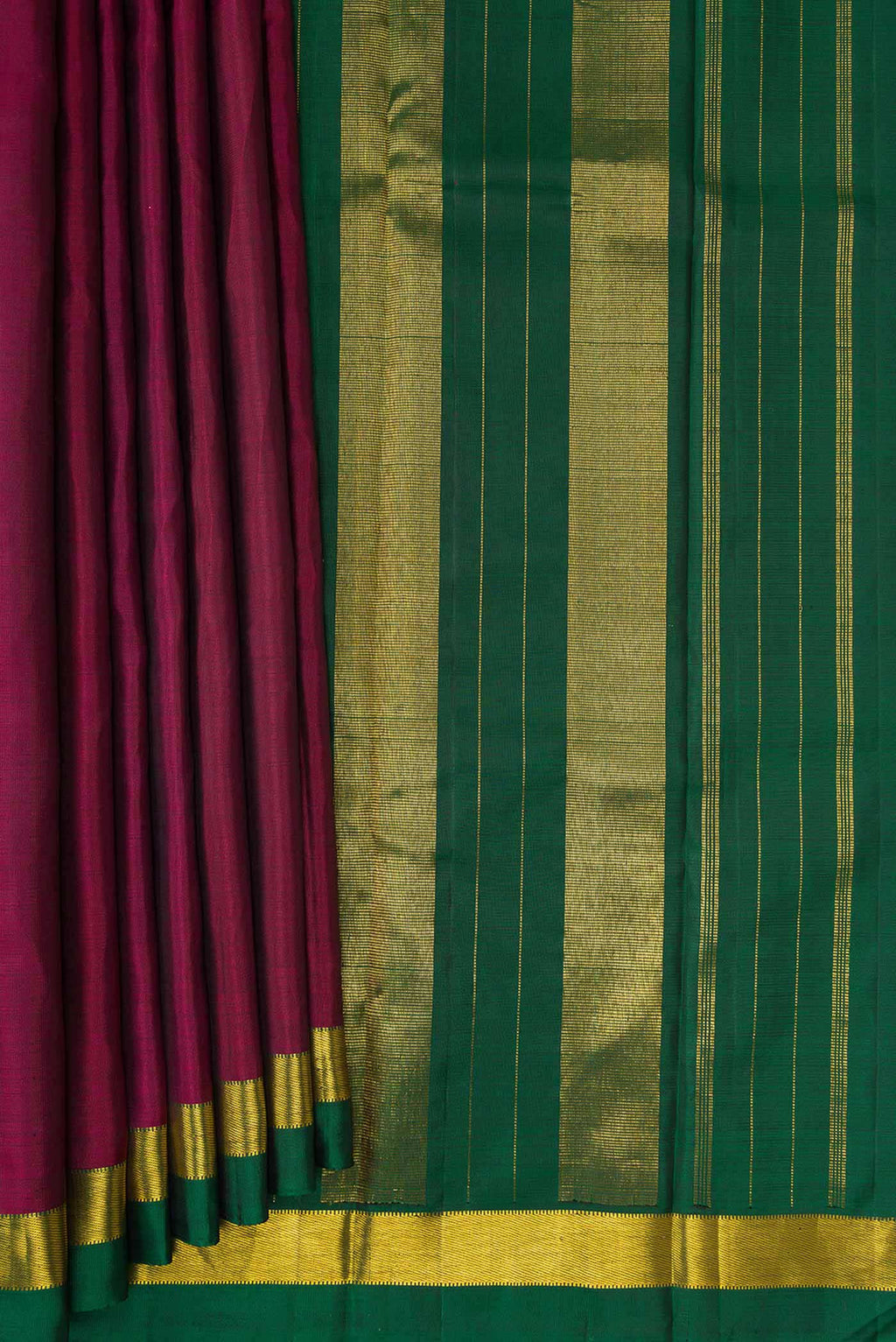 Pleats and pallu of Maroon Dual Tone Kanjivaram Silk Saree with Plain Body and Zari Border. 