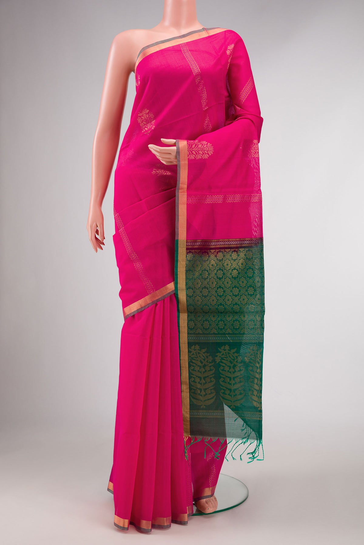 Pink Dual Tone Silk Cotton Saree with Zari Butta on the body and Zari Border displayed on a mannequin