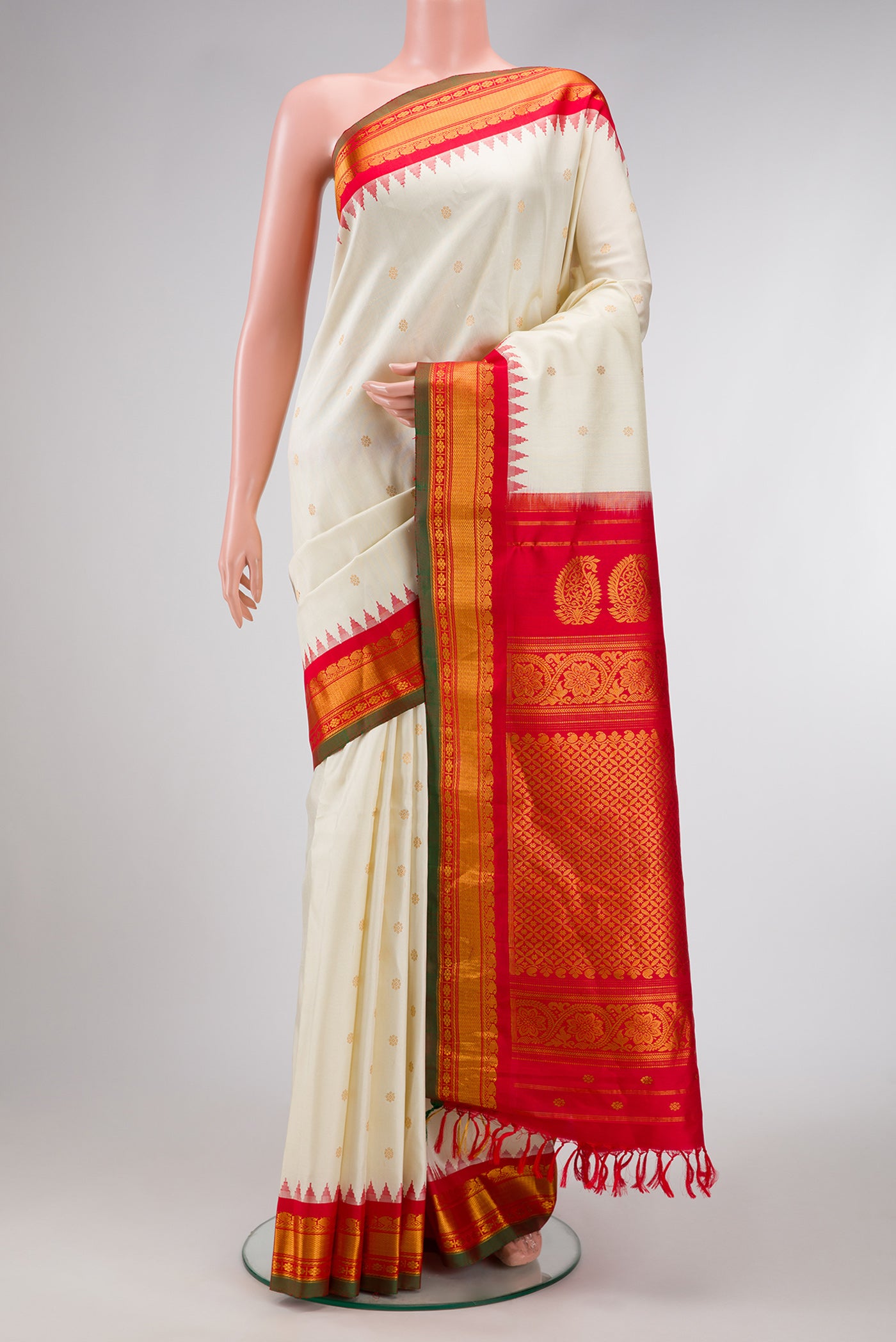 Off White Dual Tone Gadwal Silk Saree with Zari Butta on the body and Zari Border.  displayed on a mannequin