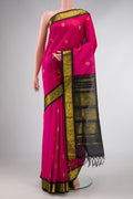 Dark Pink Dual Tone Silk Cotton Saree with Zari Butta on the body and Zari Border displayed on a mannequin