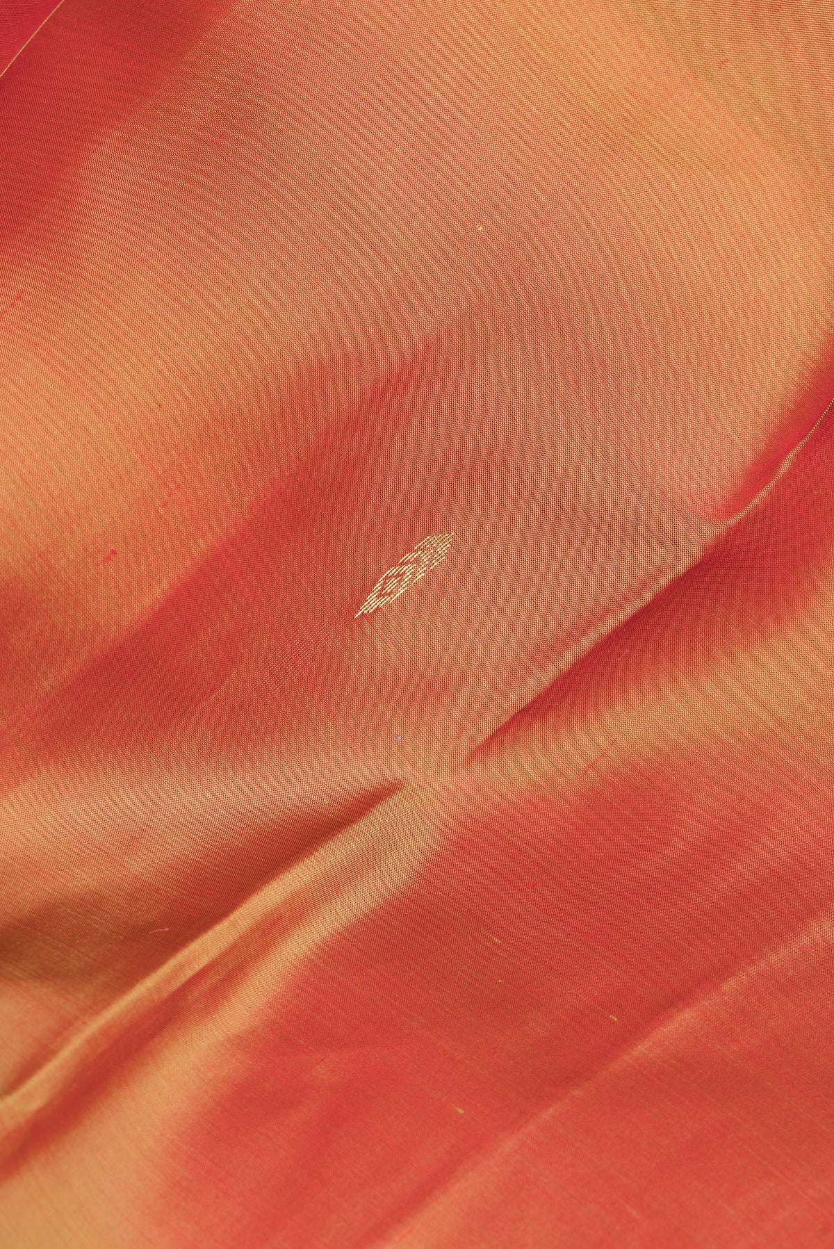 Close up of Pure Silk Mustard Dual Tone Kanjivaram Saree with Zari Butta on the body and Fancy Border.  displaying folds