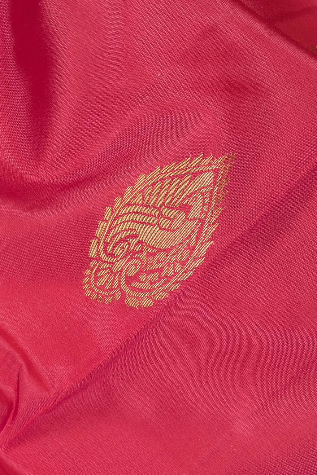 Close up of Pure Silk Imperial Red Dual Tone Kanjivaram Saree with Zari Butta on the body and Fancy Border.  displaying folds