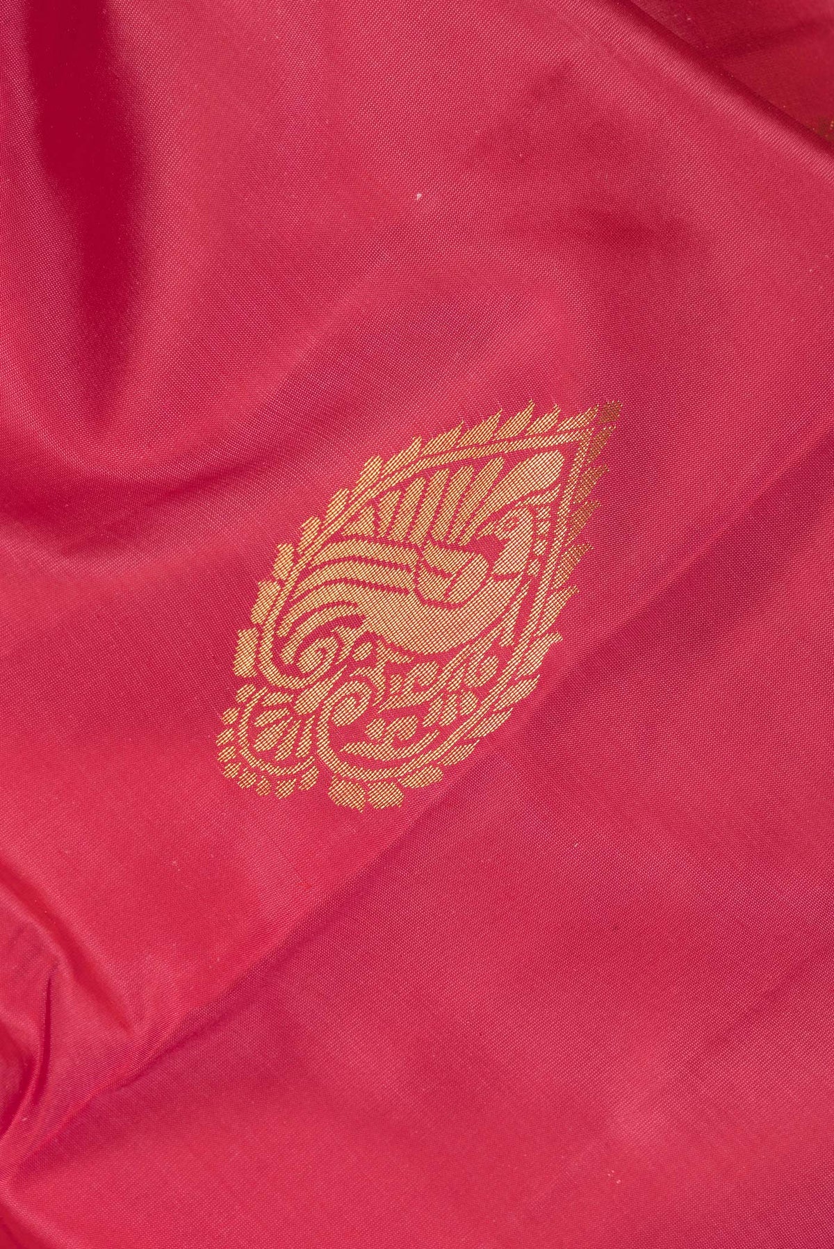 Close up of Pure Silk Imperial Red Dual Tone Kanjivaram Saree with Zari Butta on the body and Fancy Border.  displaying folds