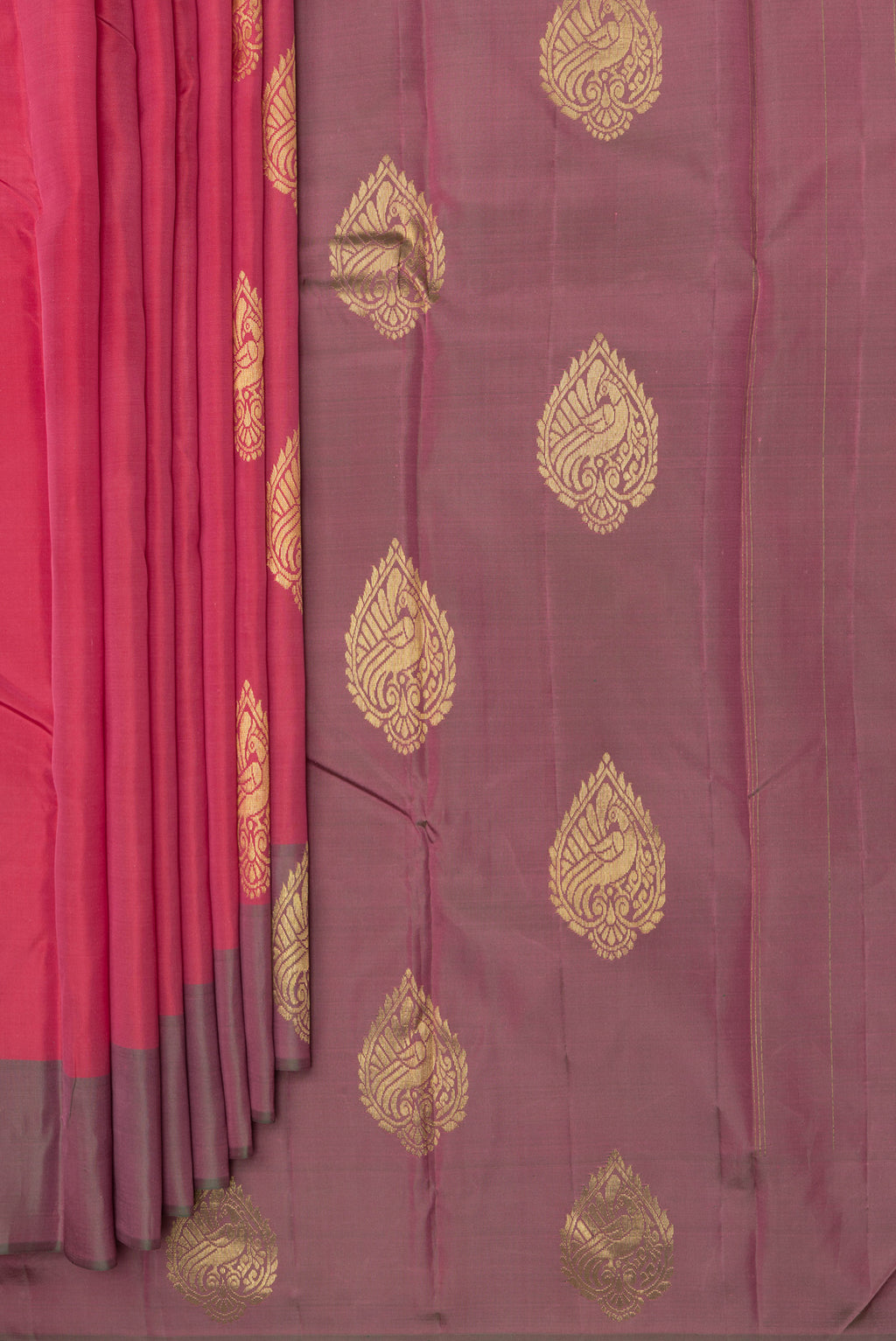 Pleats and pallu of Pure Silk Imperial Red Dual Tone Kanjivaram Saree with Zari Butta on the body and Fancy Border. 