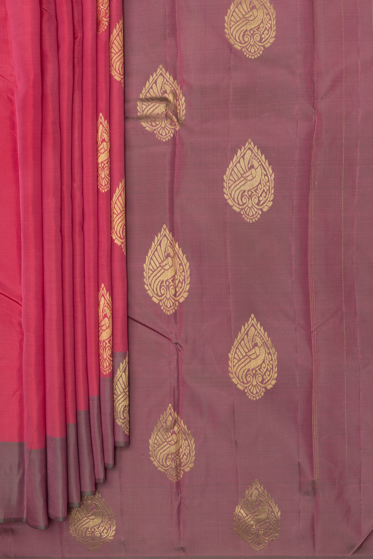 Pleats and pallu of Pure Silk Imperial Red Dual Tone Kanjivaram Saree with Zari Butta on the body and Fancy Border. 