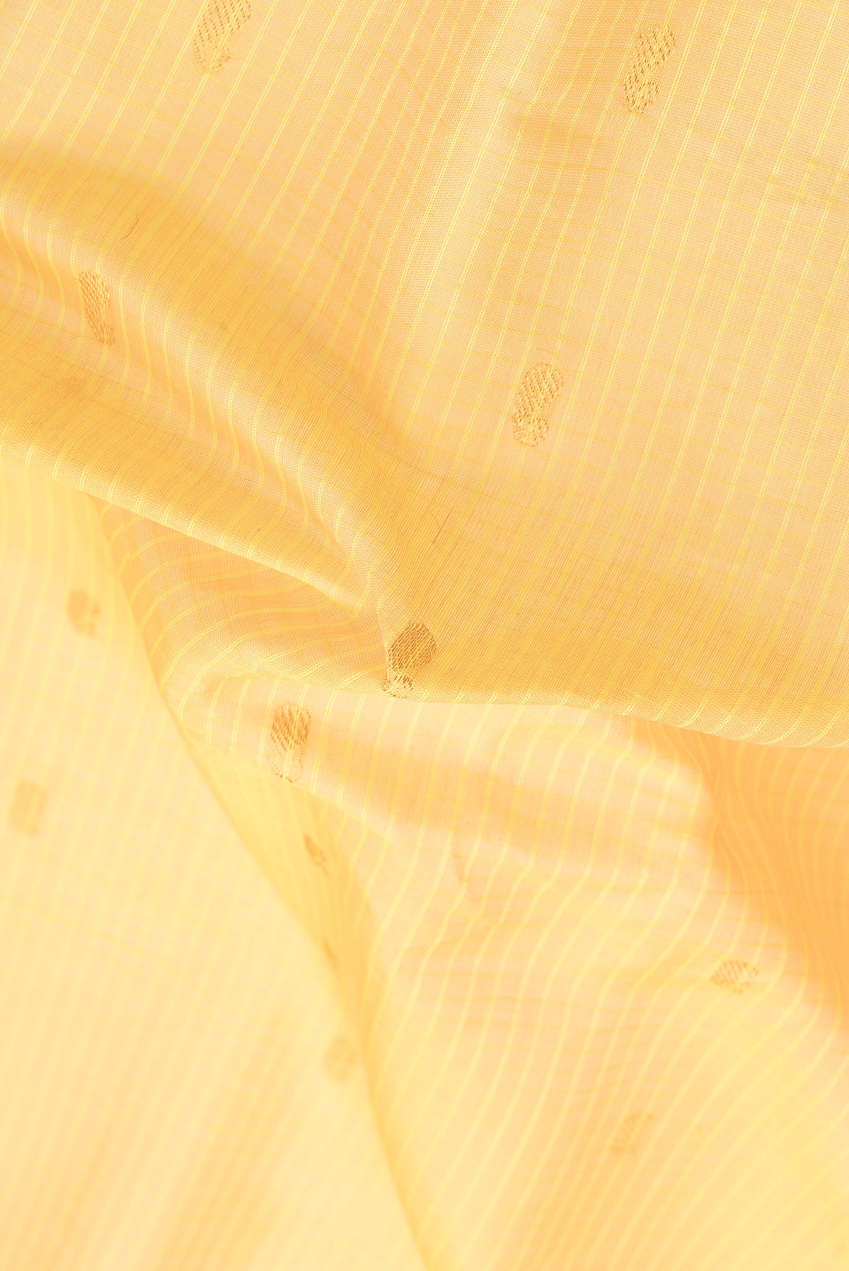 Close up of Sandal Dual Tone Gadwal Silk Cotton Saree with Checked design on the body and Zari Border.  displaying folds