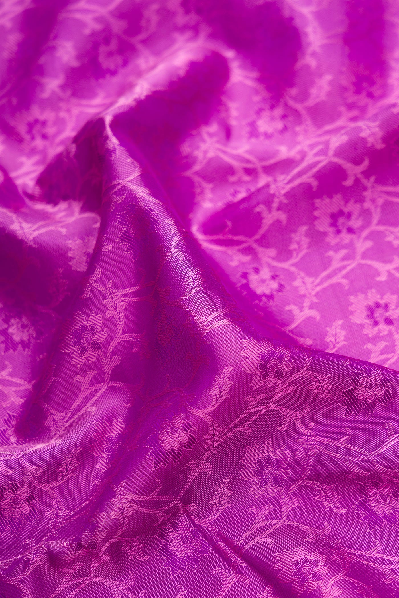 Close up of Purple Dual Tone Kanchipuram Silk Saree with Jacquard design on the body and Zari And Thread Border.  displaying folds