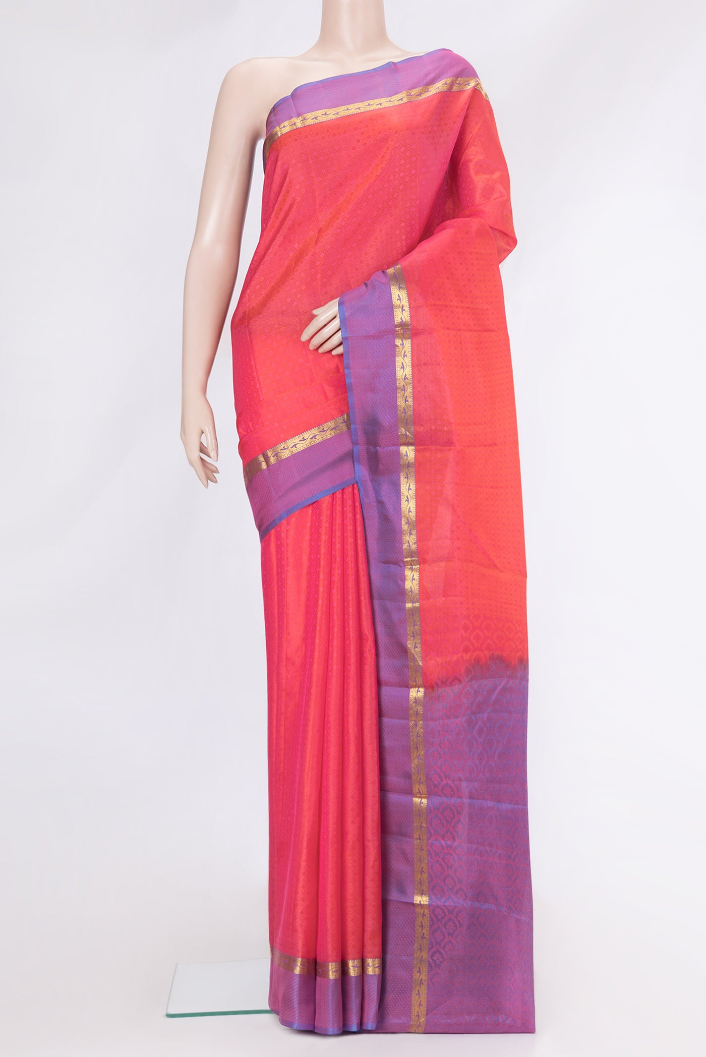 Coral Dual Tone Kanchipuram Silk Saree with Jacquard design on the body and Zari And Thread Border.  displayed on a mannequin