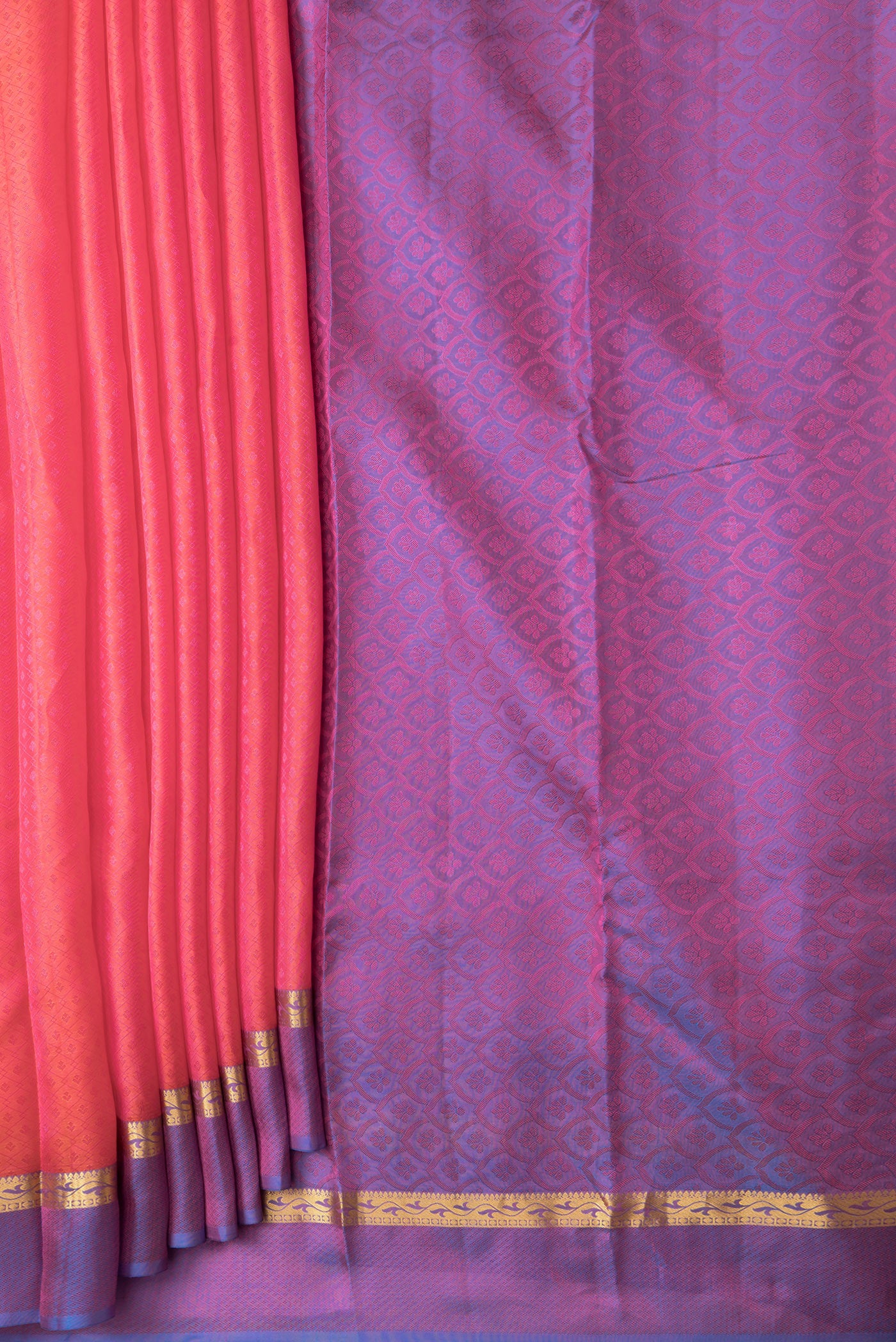 Pleats and pallu of Coral Dual Tone Kanchipuram Silk Saree with Jacquard design on the body and Zari And Thread Border. 