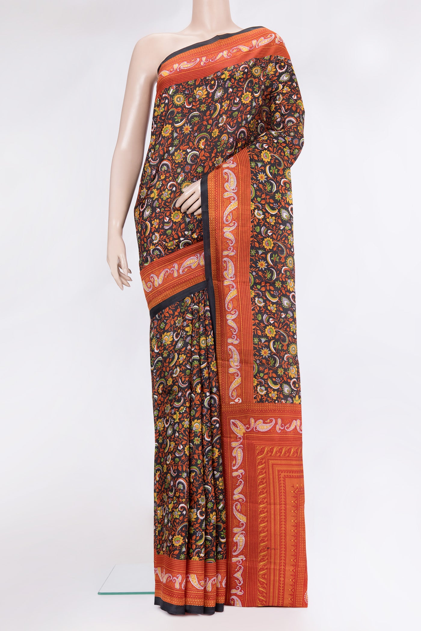 Black Printed Silk Saree with Printed design on the body and Printed Border.  displayed on a mannequin