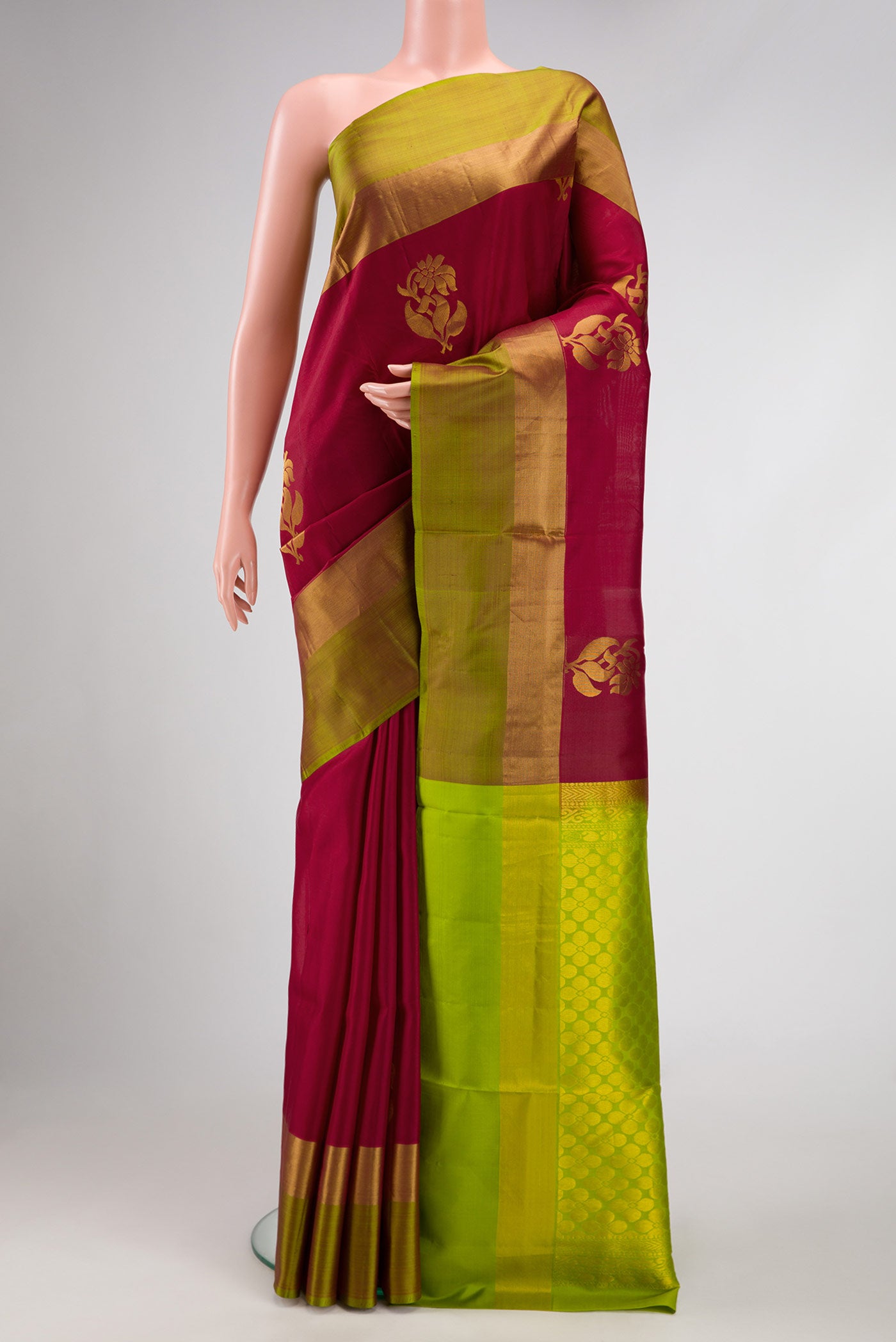 Maroon Dual Tone Soft Silk Saree with Zari Butta on the body and Zari Border.  displayed on a mannequin