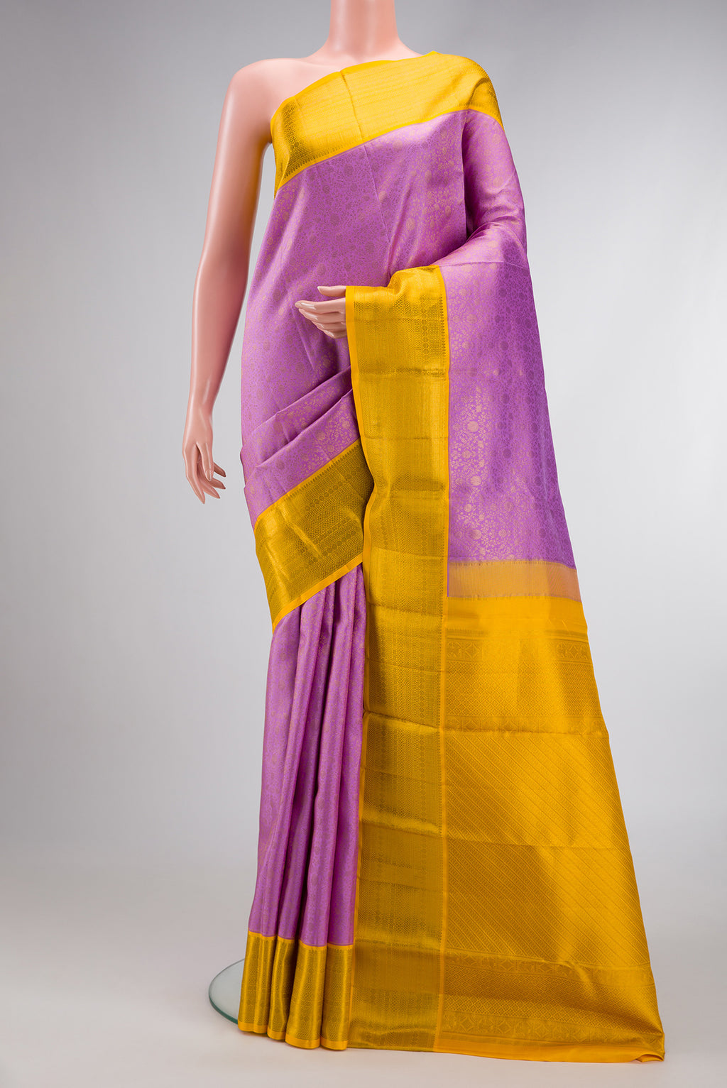 Lavender Dual Tone Kanchipuram Silk Saree with Zari Brocade on the body and Zari Border.  displayed on a mannequin