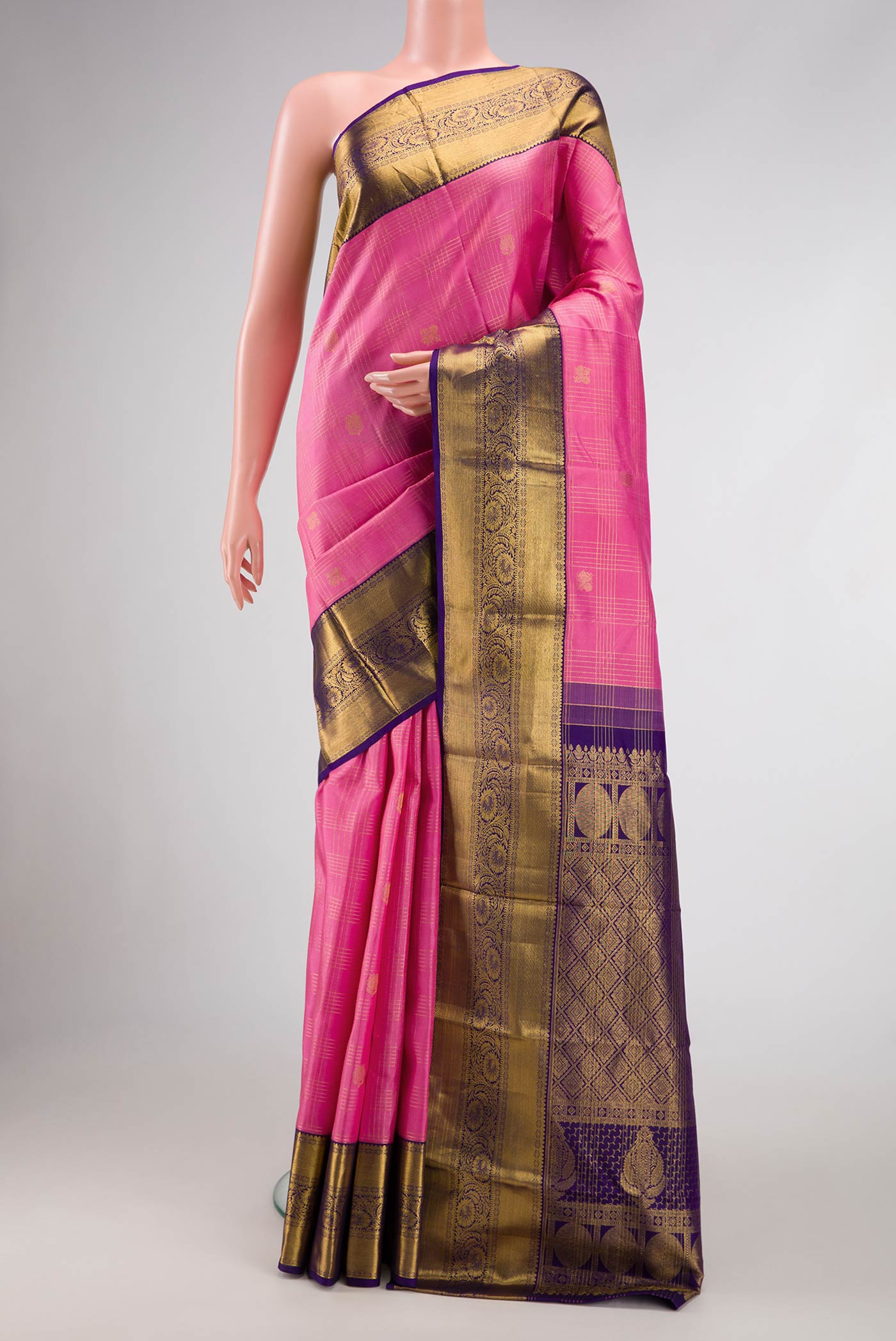 Pink Dual Tone Kanjivaram Silk Saree with Checked design on the body and Zari Border.  displayed on a mannequin