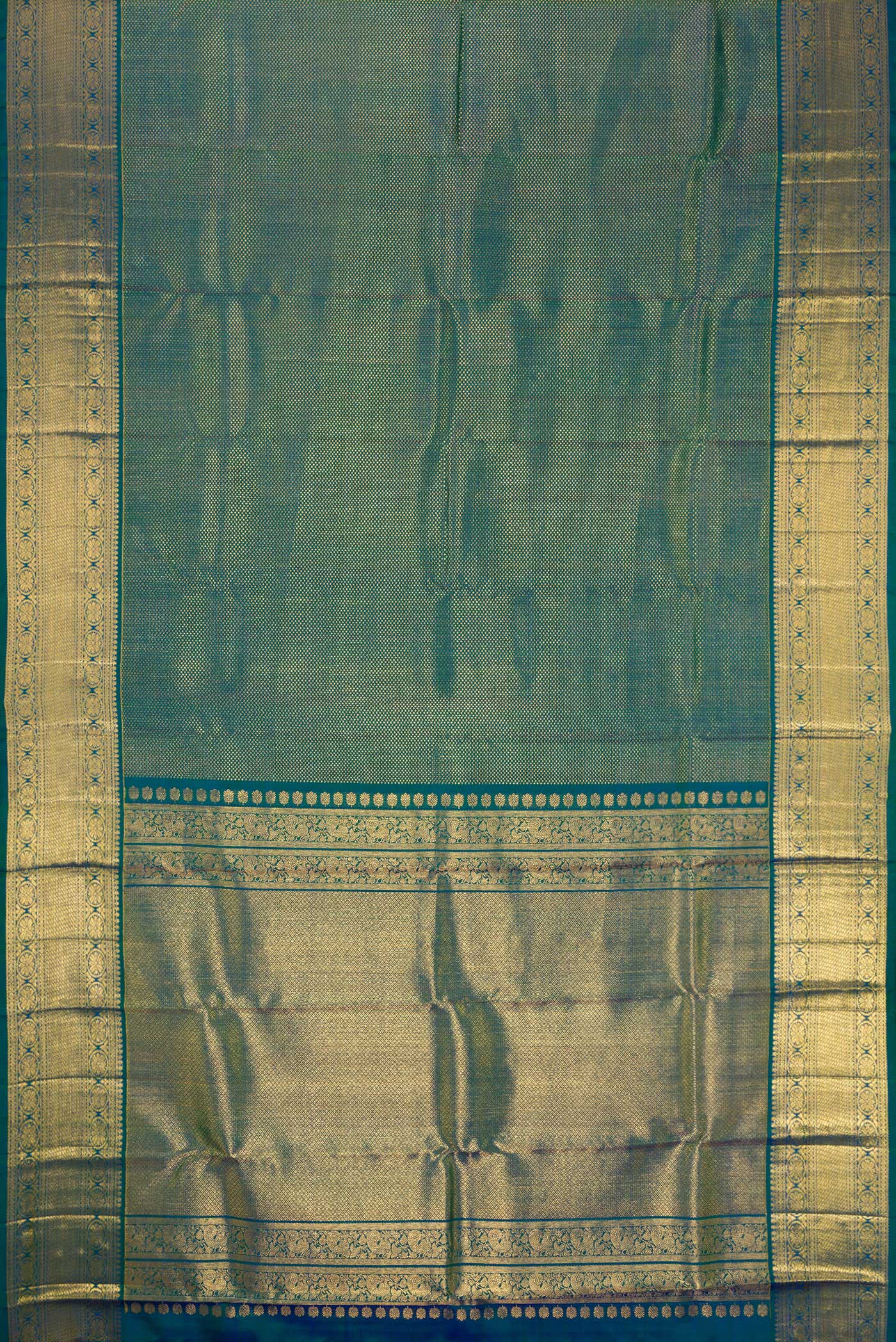 Flat view of Peacock Blue Dual Tone Kanjivaram Silk Saree with Zari Brocade on the body and Zari Border. 