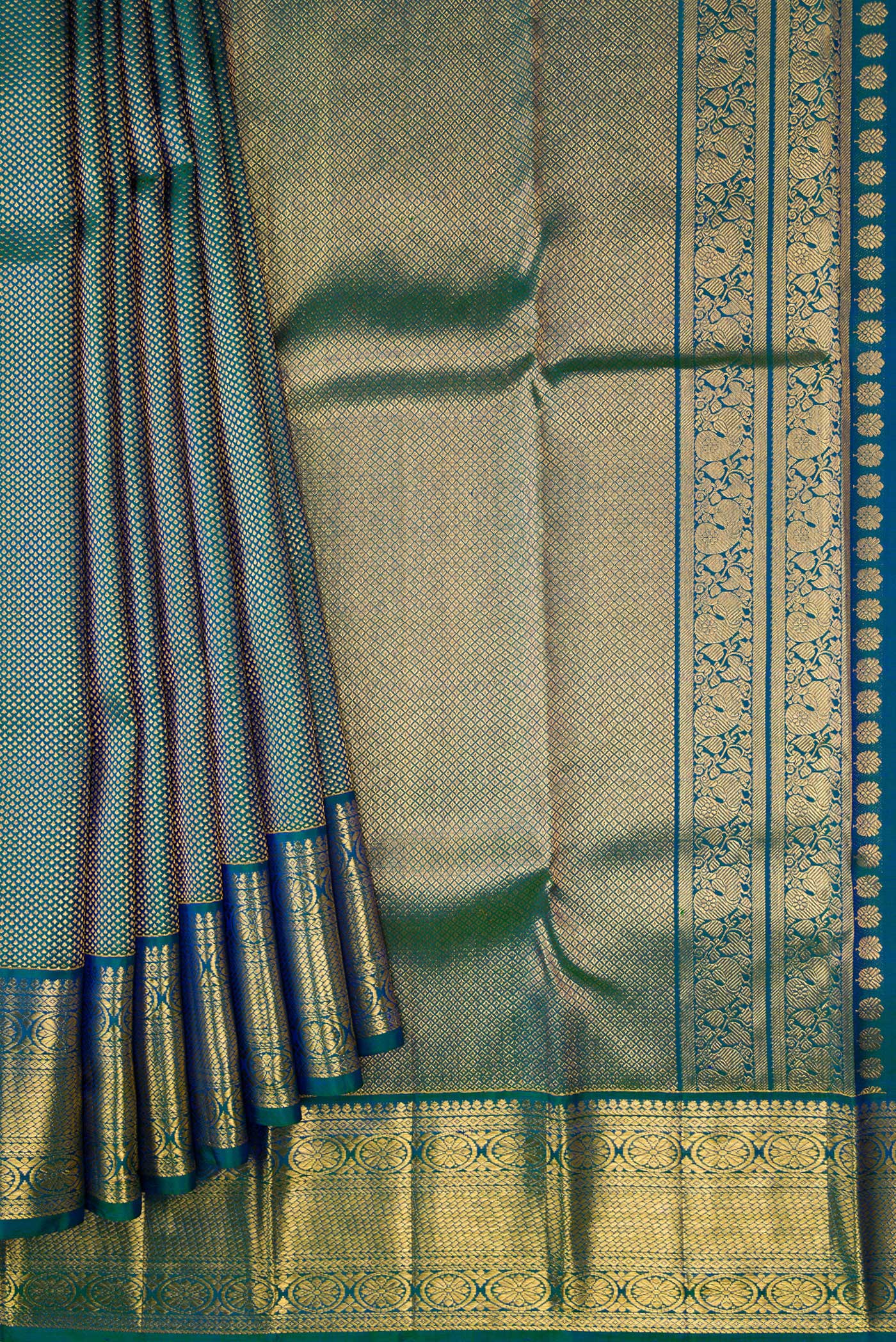 Pleats and pallu of Peacock Blue Dual Tone Kanjivaram Silk Saree with Zari Brocade on the body and Zari Border. 