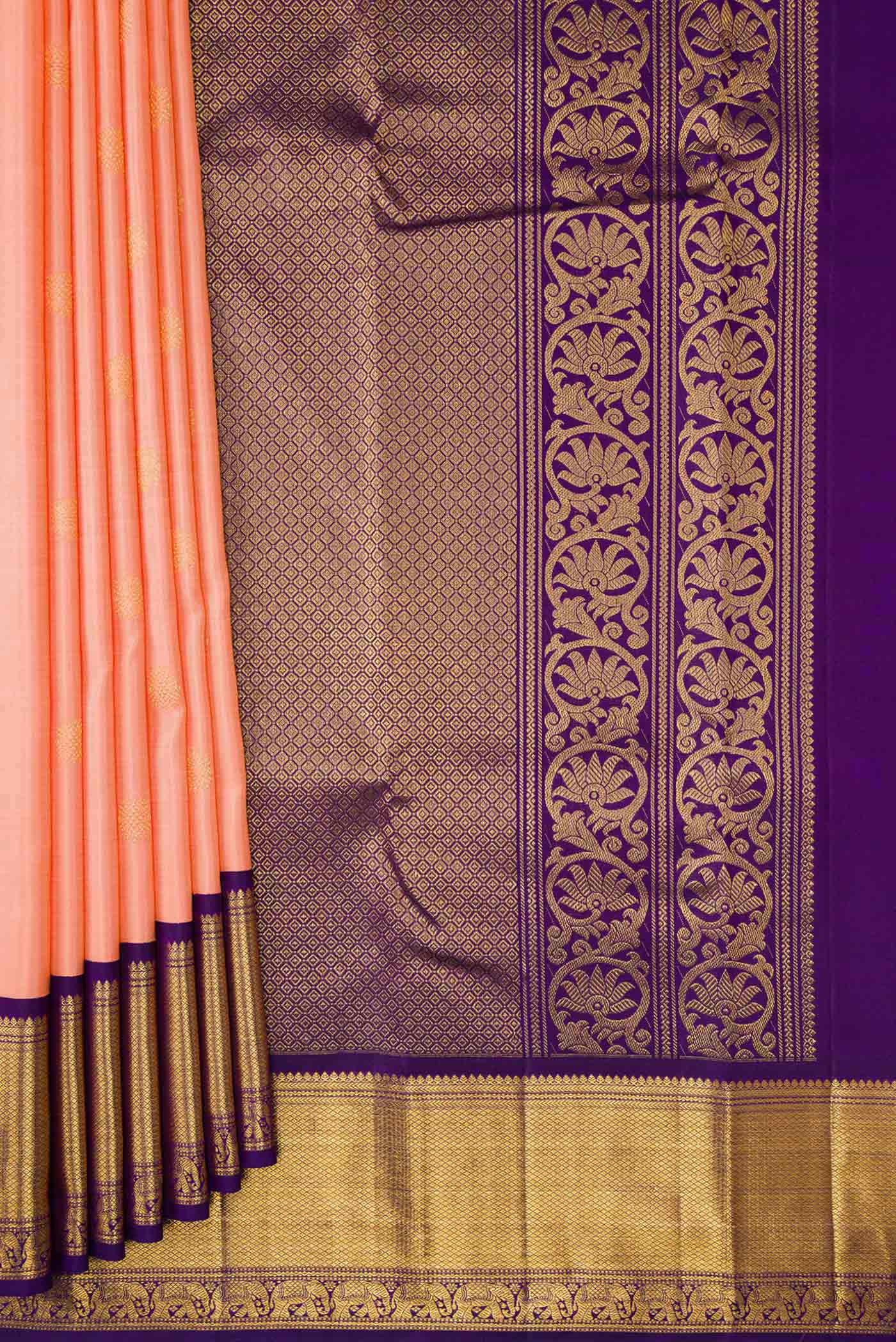 Pleats and pallu of Peach Dual Tone Kanchipuram Silk Saree with Zari Butta on the body and Zari Border. 