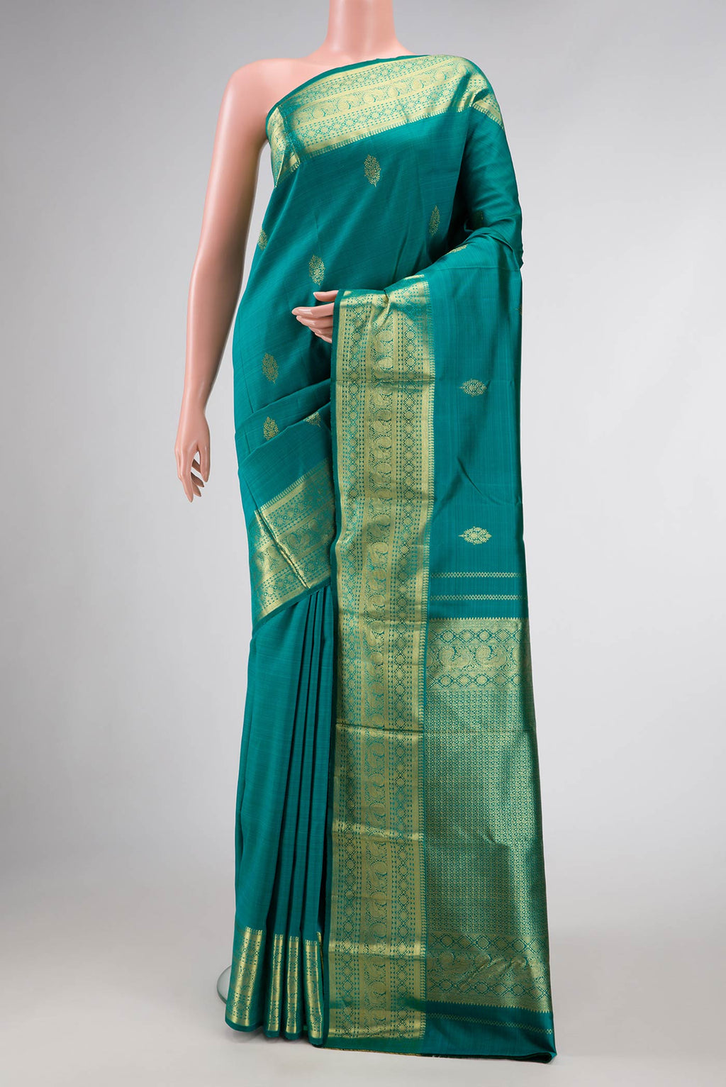 Peacock Blue Dual Tone Kanchipuram Silk Saree with Zari Butta on the body and Zari Border.  displayed on a mannequin