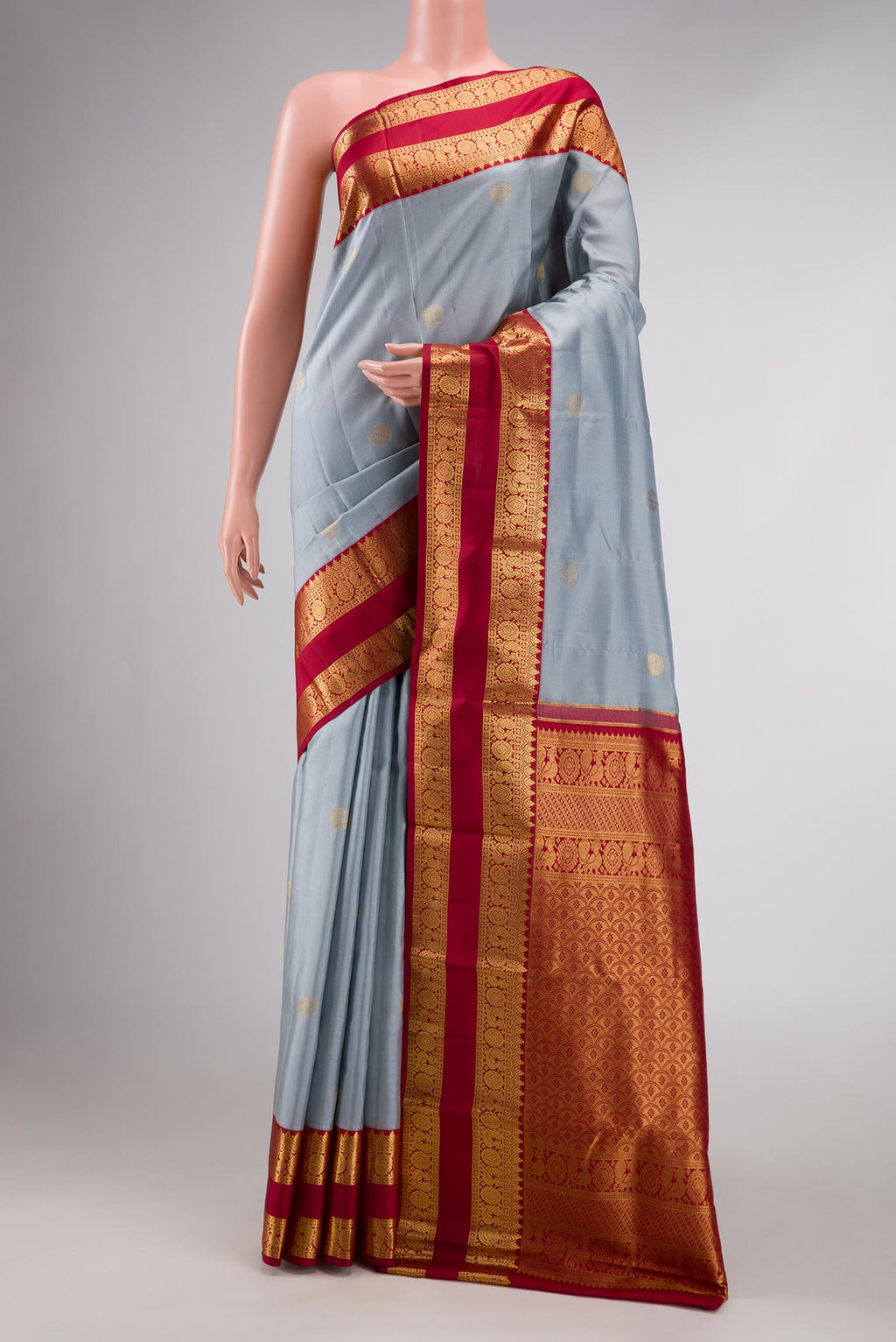 Grey Dual Tone Kanchipuram Silk Saree with Zari Butta on the body and Zari Border displayed on a mannequin