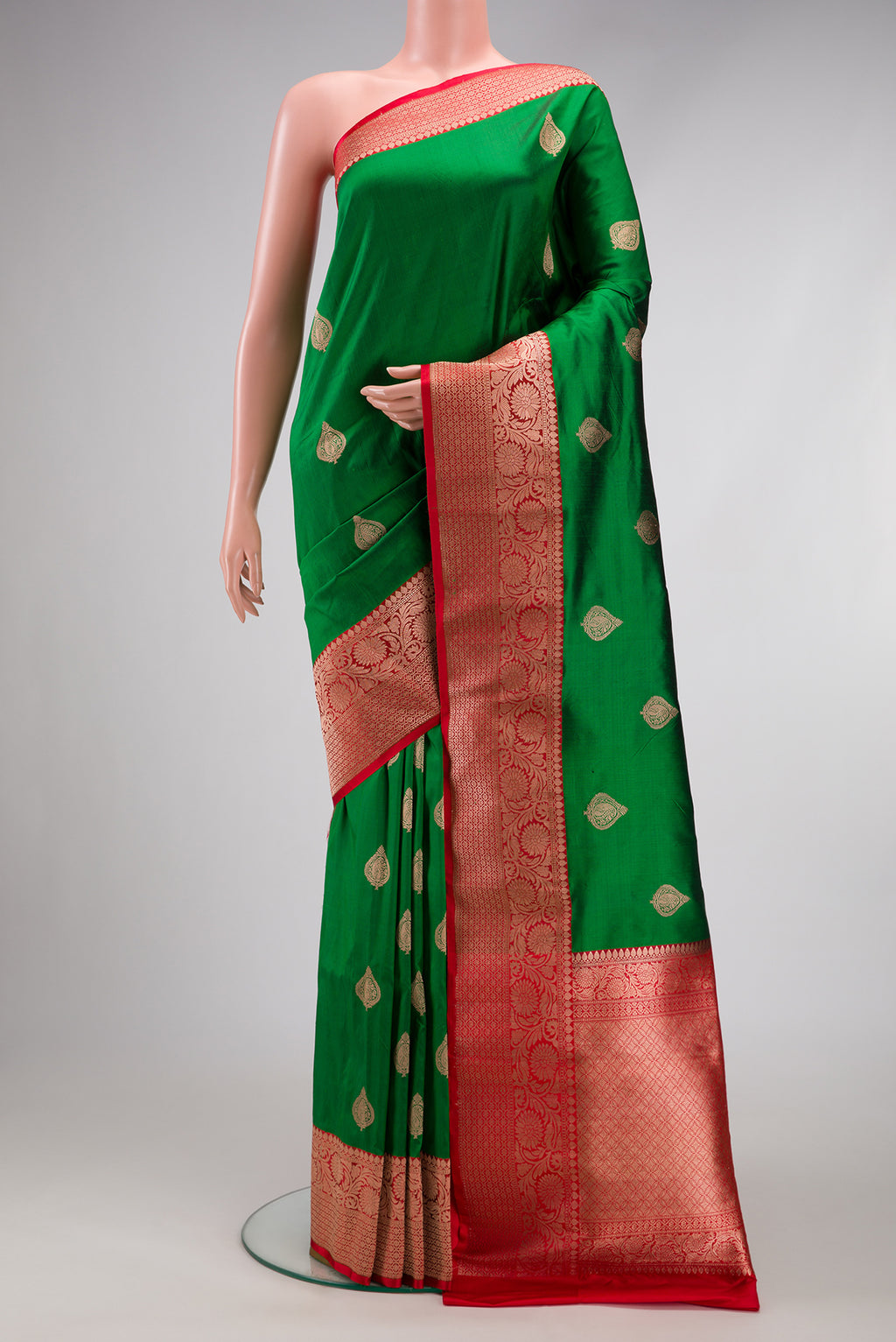 Green Dual Tone Banarasi Silk Saree with Zari Butta on the body and Zari Border.  displayed on a mannequin