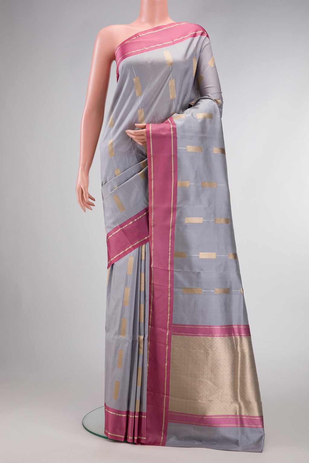 Grey Dual Tone Banarasi Silk Saree with Stripes on the body and Zari Border.  displayed on a mannequin