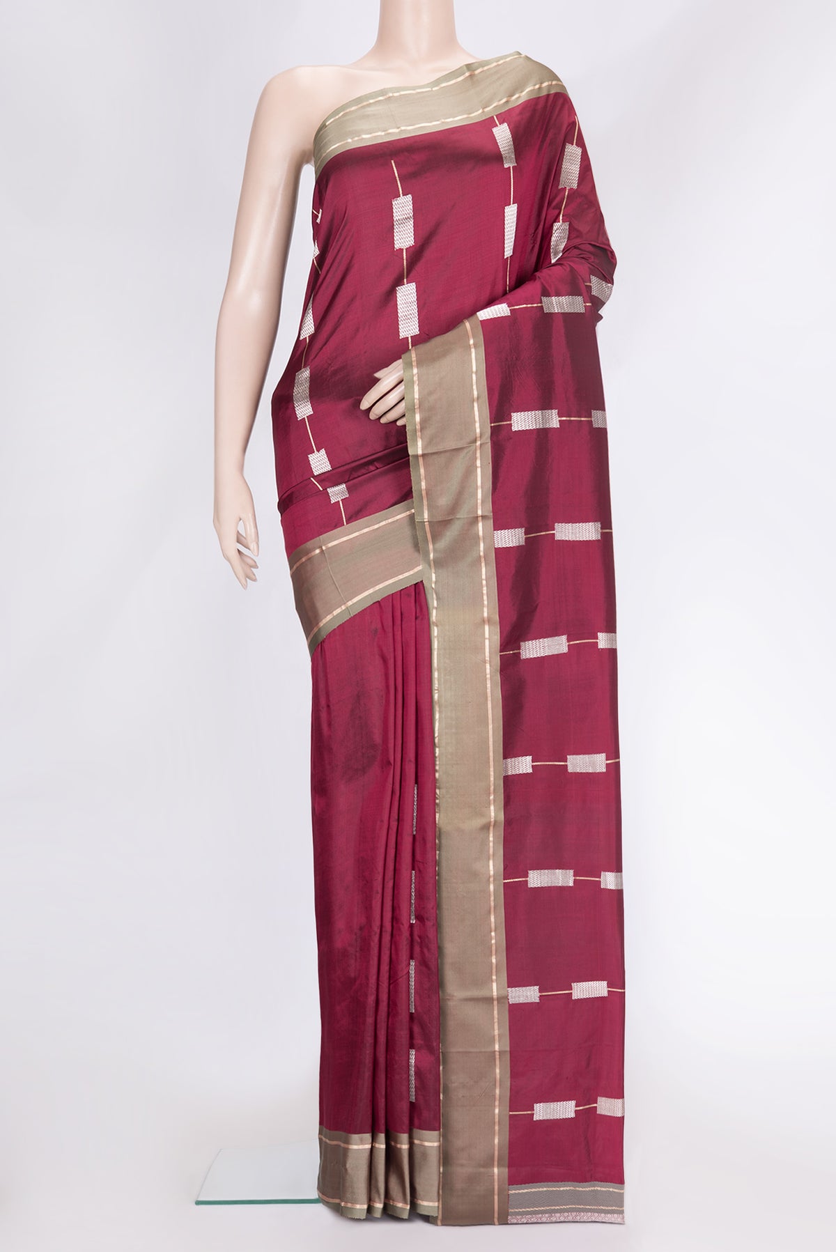 Maroon Dual Tone Banarasi Silk Saree with Zari Butta on the body and Zari Border.  displayed on a mannequin