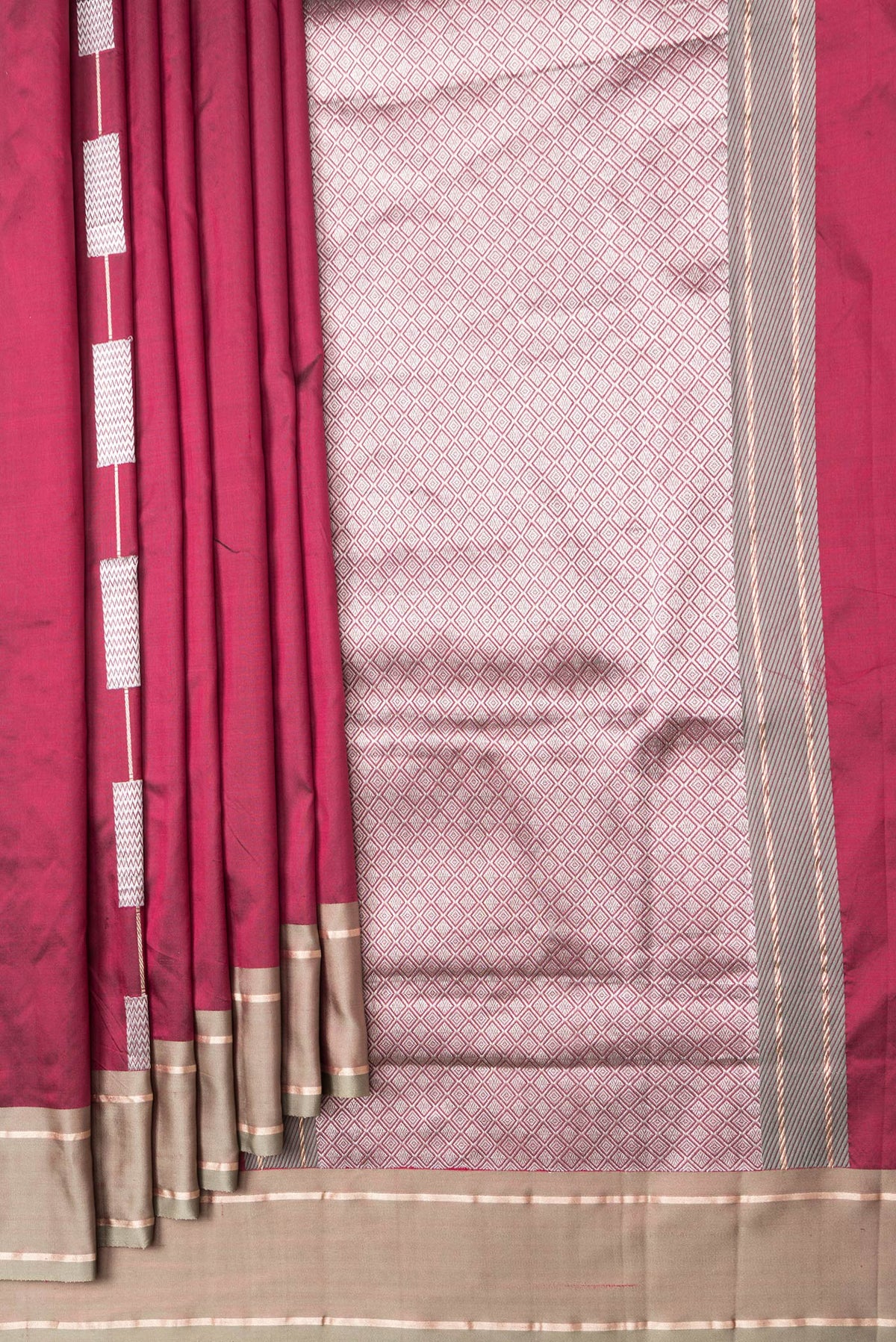 Pleats and pallu of Maroon Dual Tone Banarasi Silk Saree with Zari Butta on the body and Zari Border. 