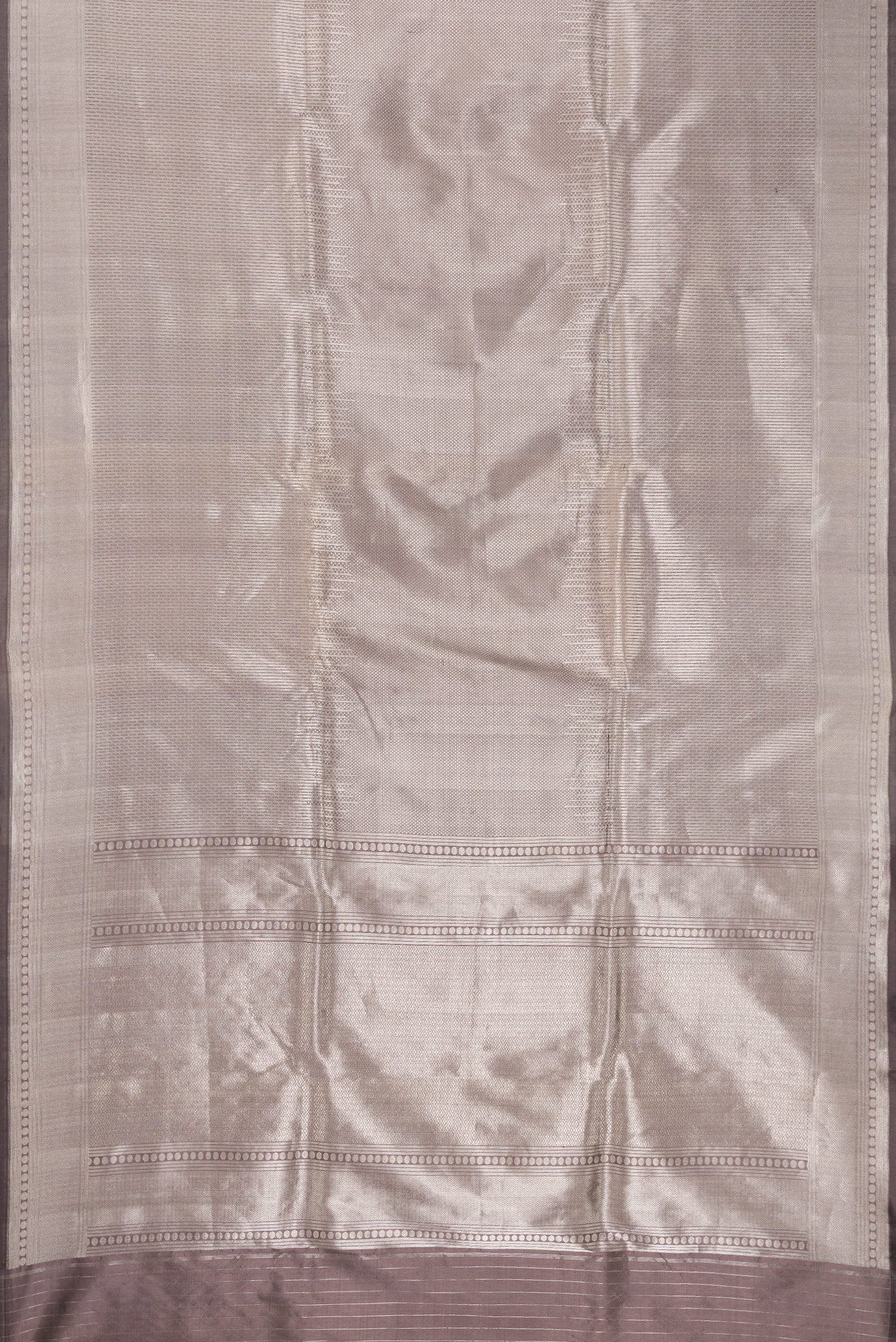 Flat view of Grey Dual Tone Banarasi Silk Saree with Zari Brocade on the body and Zari Border. 