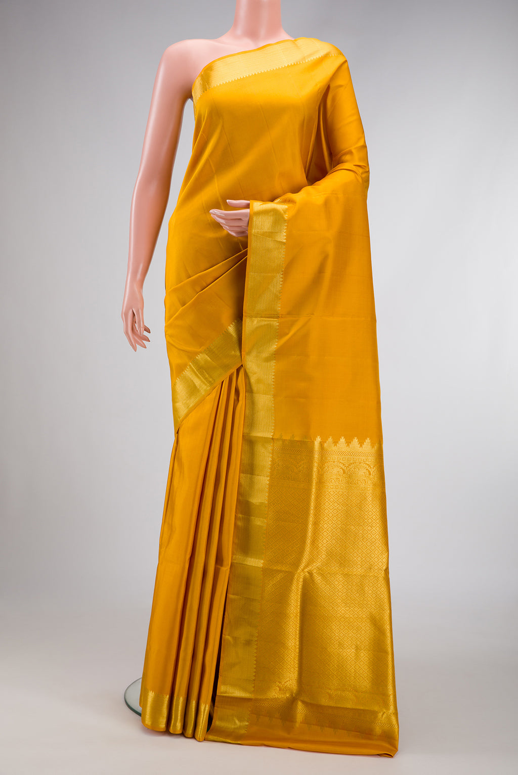 Mustard Dual Tone Kanjivaram Silk Nine Yards Saree with Plain Body and Zari Border.  displayed on a mannequin