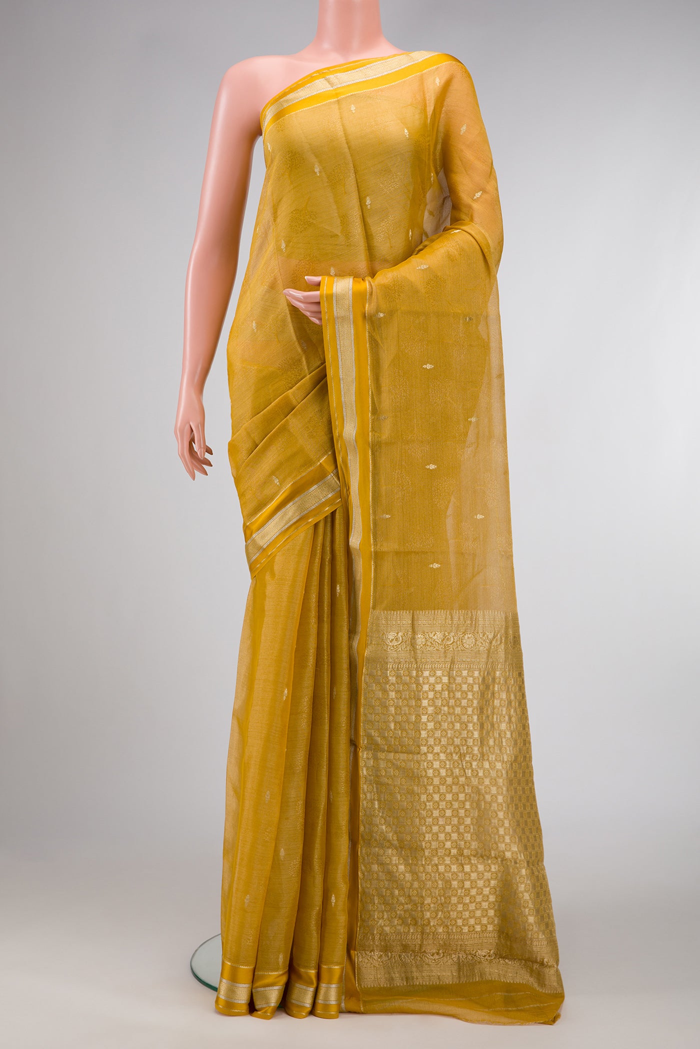 Mustard Dual Tone Mysore Georgette Saree with Zari Brocade on the body and Zari Border.  displayed on a mannequin
