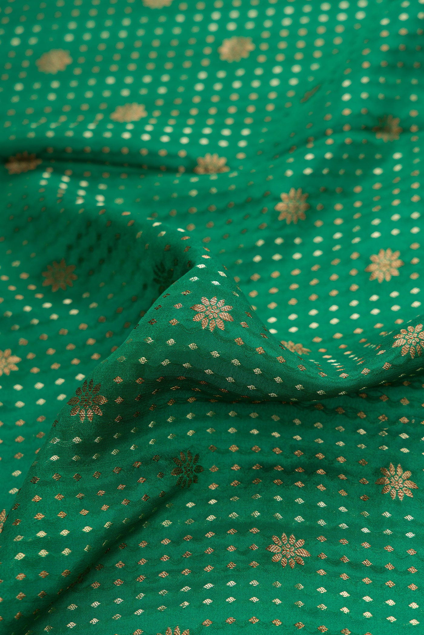 Close up of Bottle Green Dual Tone Banarasi Georgette Saree with Stripes on the body and Zari Border.  displaying folds
