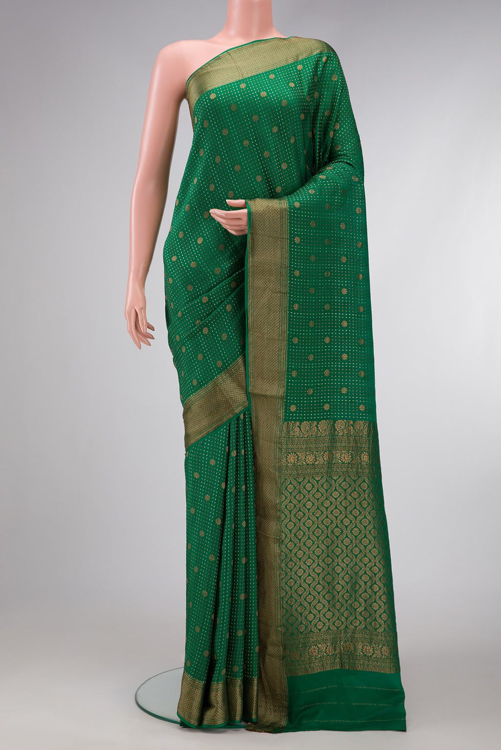 Bottle Green Dual Tone Banarasi Georgette Saree with Stripes on the body and Zari Border.  displayed on a mannequin