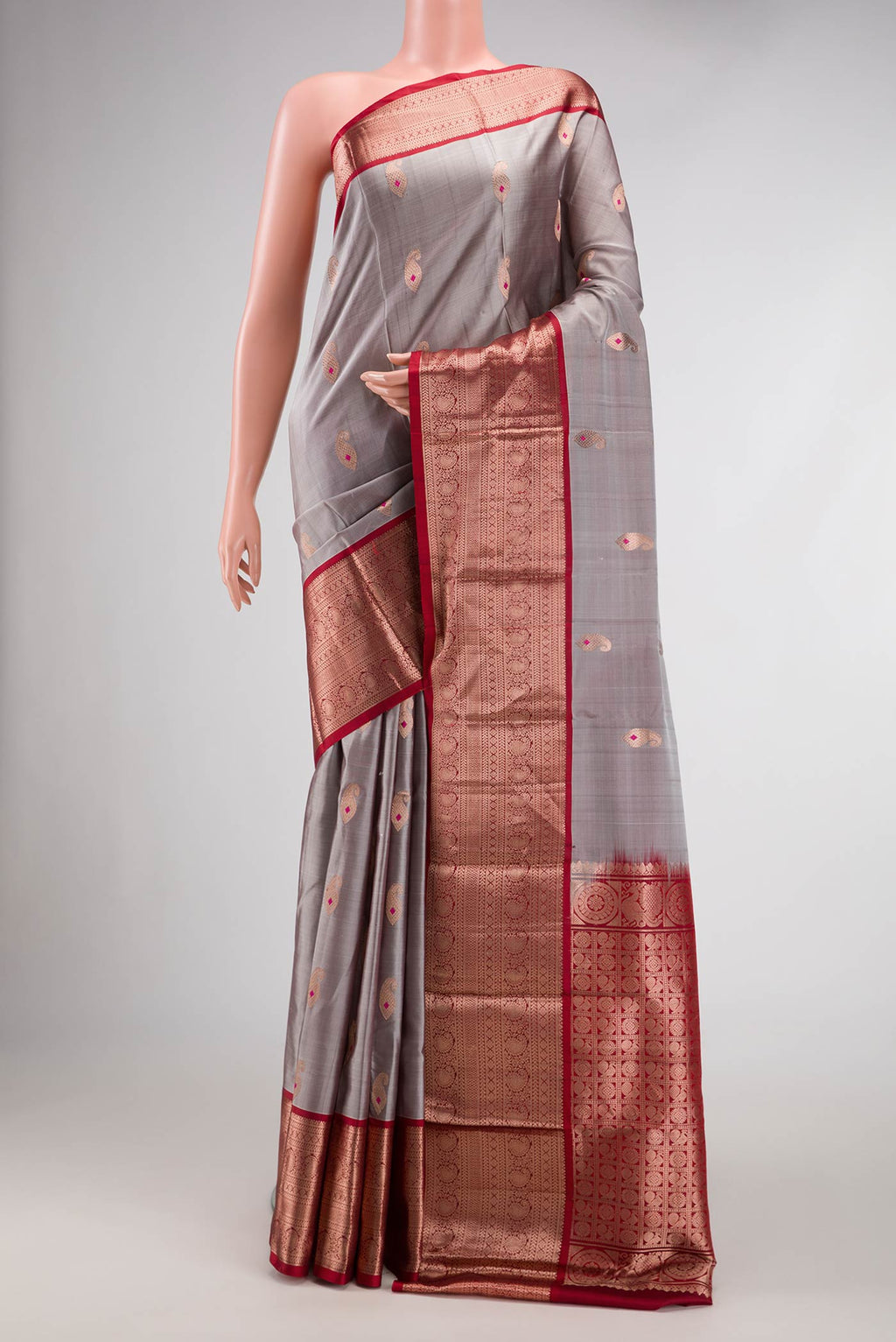 Grey Dual Tone Kanjivaram Silk Saree with Zari Butta on the body and Zari Border.  displayed on a mannequin