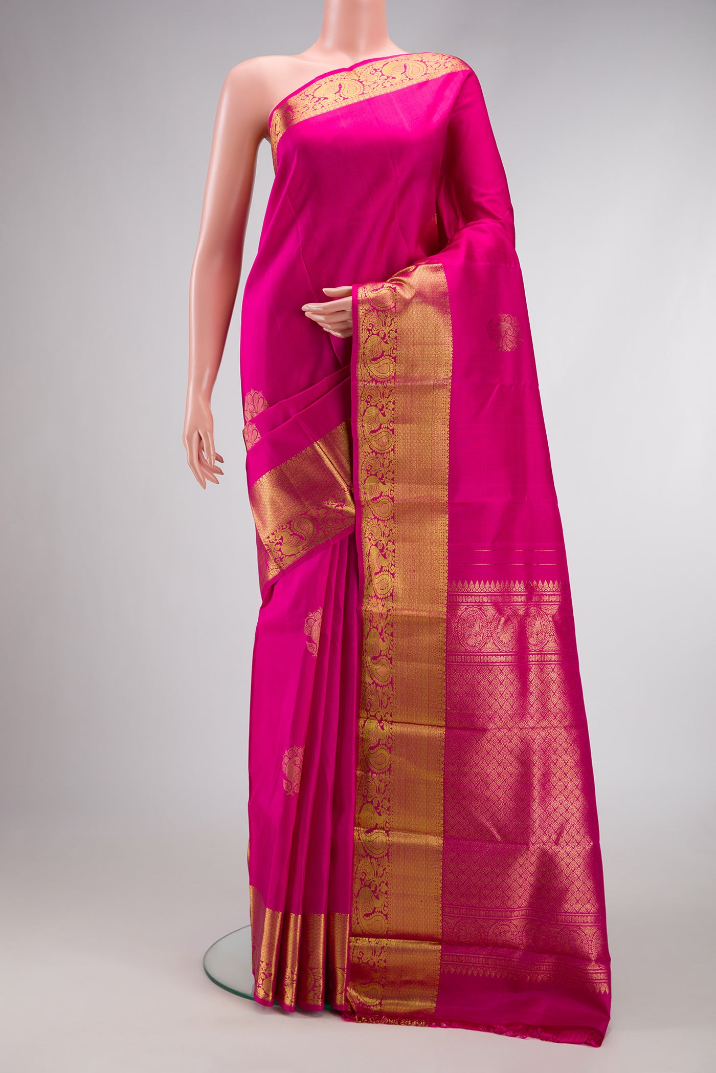 Pink Dual Tone Kanchipuram Silk Saree with Zari Butta on the body and Zari Border.  displayed on a mannequin
