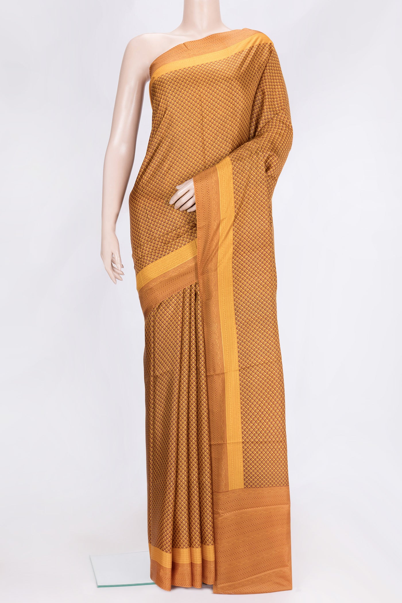 Mustard Dual Tone Printed Silk Saree with Printed design on the body and Printed Border.  displayed on a mannequin