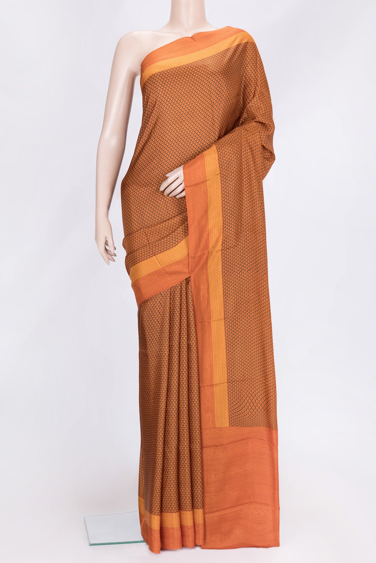 Orange Dual Tone Printed Silk Saree with Printed design on the body and Printed Border.  displayed on a mannequin