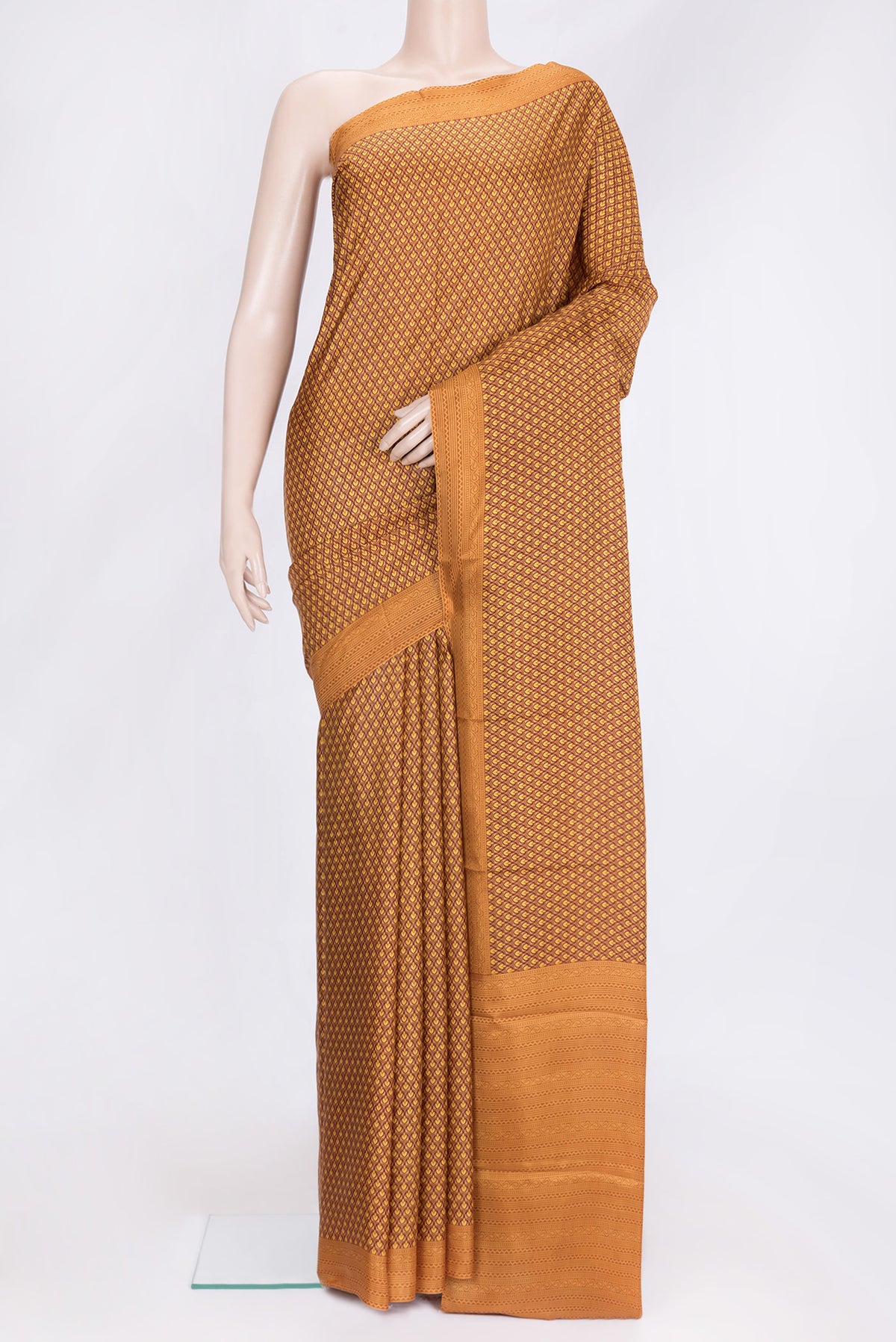 Mustard Dual Tone Printed Silk Saree with Printed design on the body and Printed Border.  displayed on a mannequin