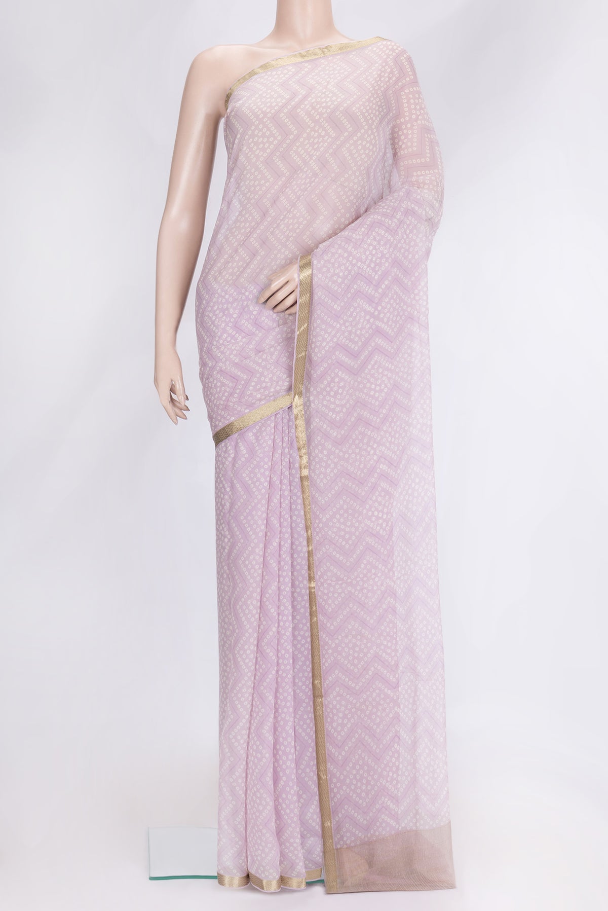 Lavender Dual Tone Mysore Georgette Saree with Bandhani Print on the body and Zari Border.  displayed on a mannequin