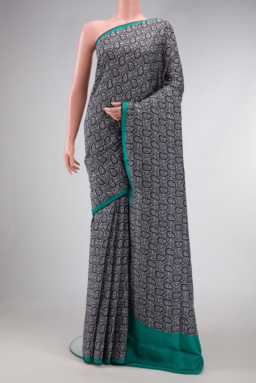 Black Dual Tone Printed Silk Saree with Printed design on the body and Embroidery Border.  displayed on a mannequin