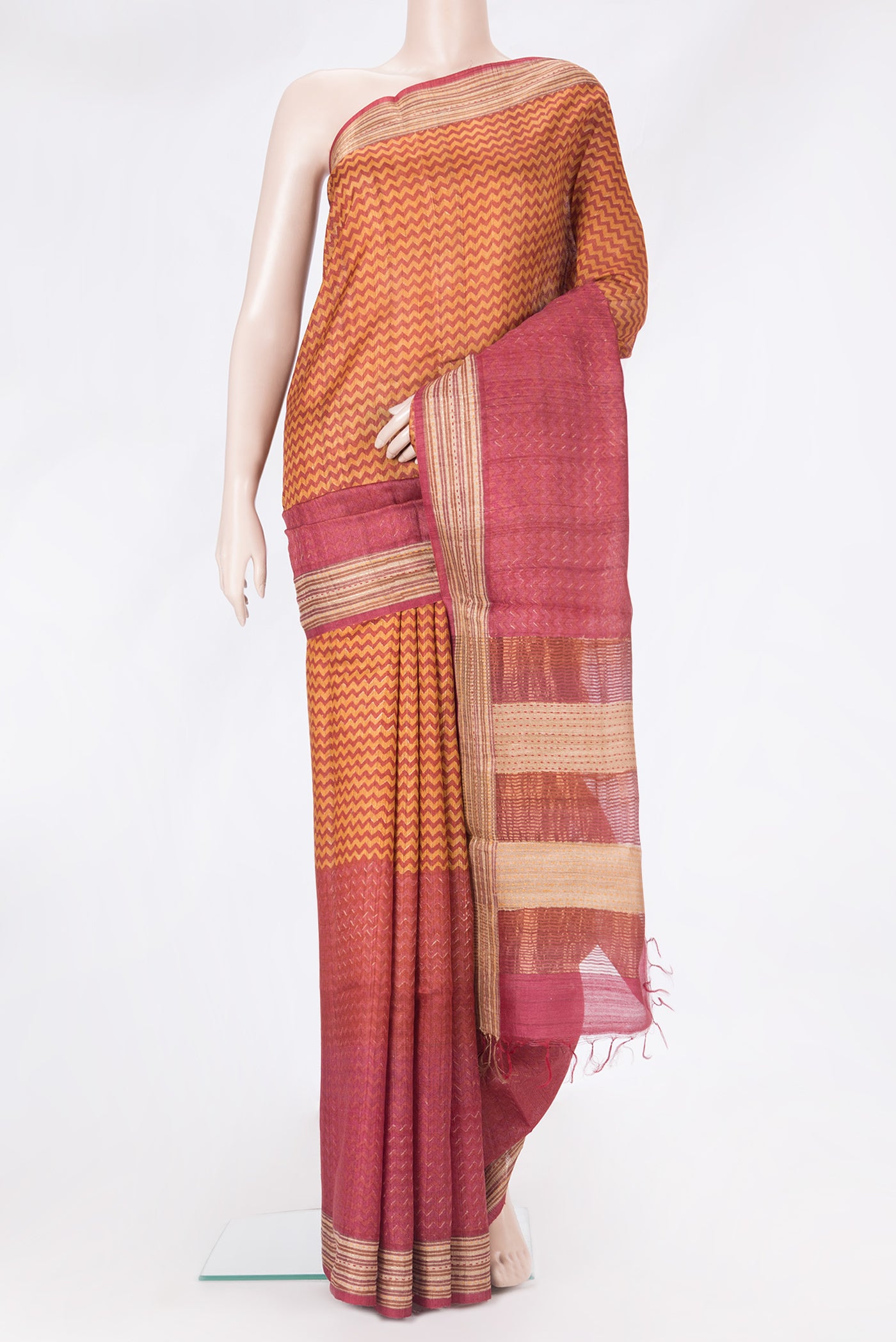 Multi Color Tussar Silk Saree with Printed design on the body and Embroidery Border.  displayed on a mannequin