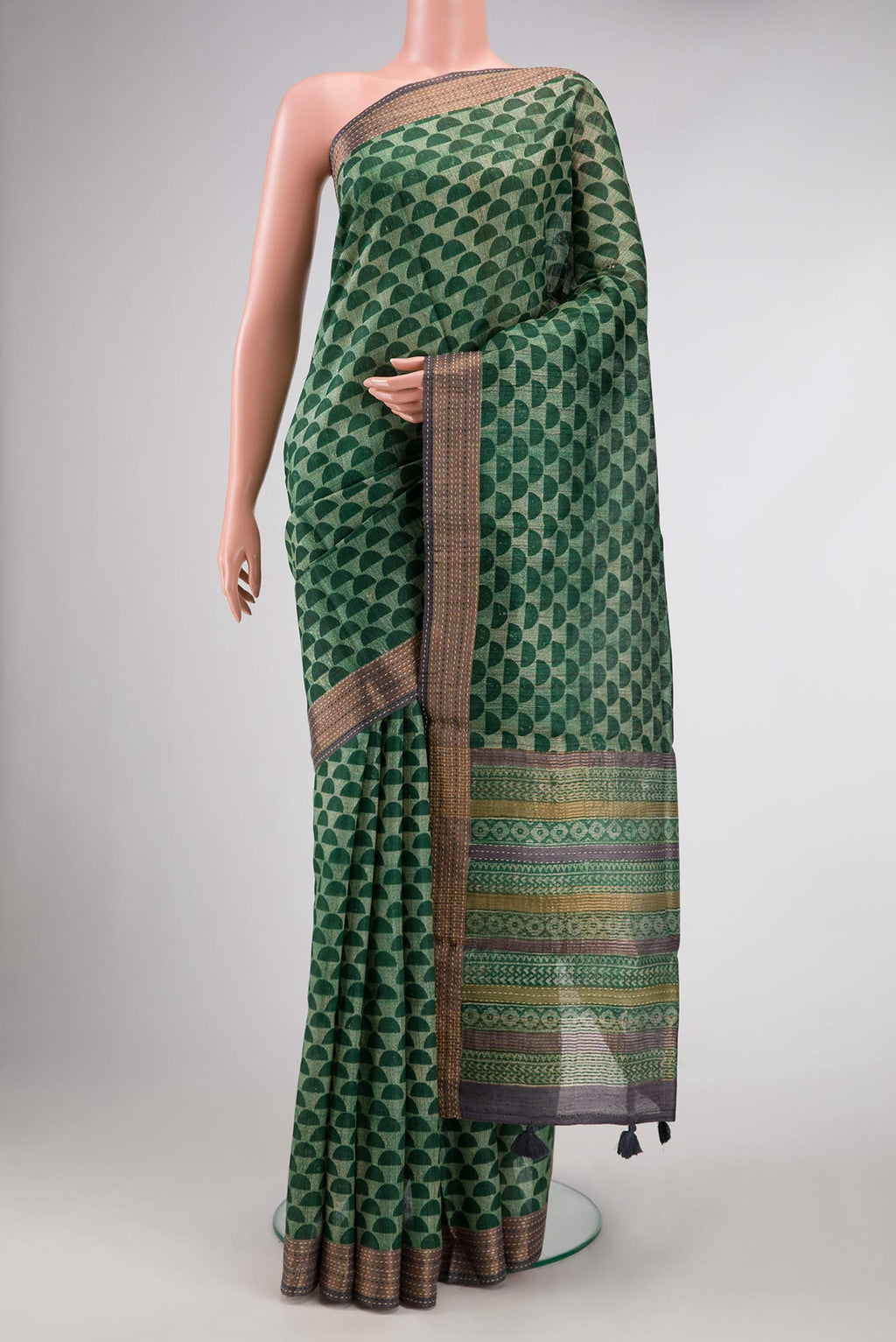 Green Dual Tone Tussar Silk Saree with Printed design on the body and Embroidery Border.  displayed on a mannequin