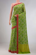 Green Dual Tone Mysore Crepe Saree with Printed design on the body and Thread Border displayed on a mannequin