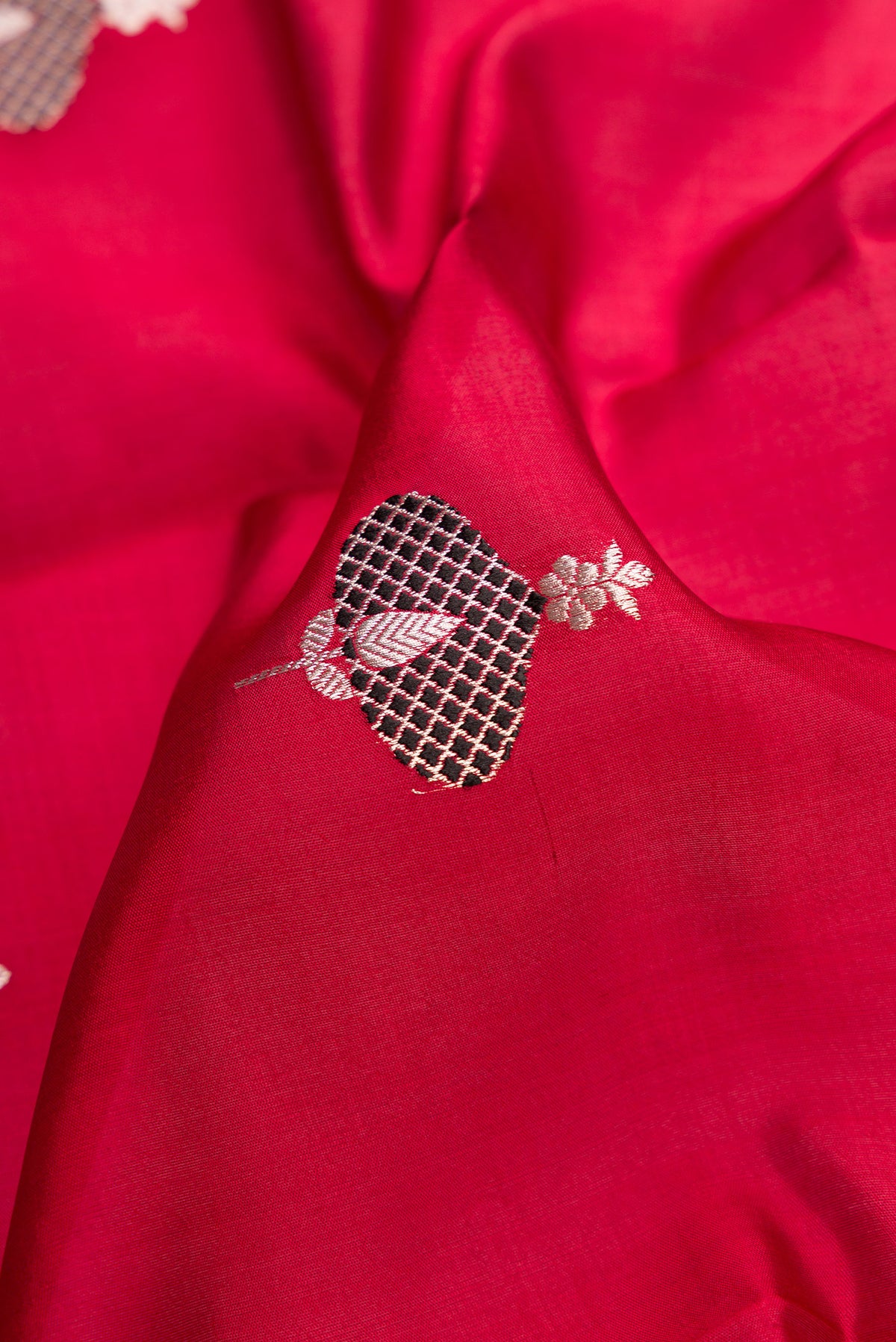 Close up of Burgundy Dual Tone Banarasi Silk Saree with Stripes on the body and Thin Zari Line.  displaying folds