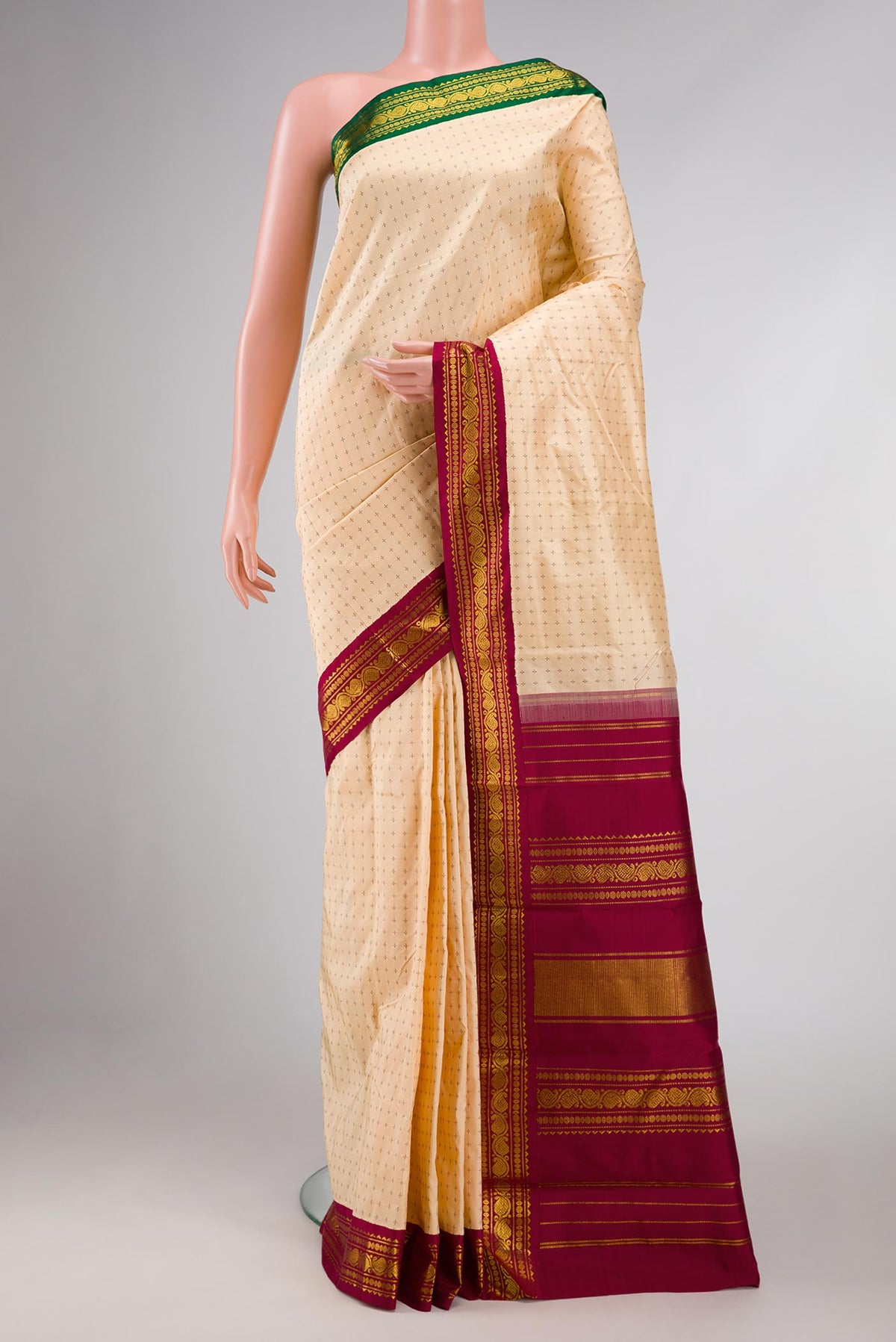 Pure Silk Pure Zari Beige Dual Tone Kanchipuram Saree with Thread Butta on the body and Ganga Jamuna Border displayed on a mannequin