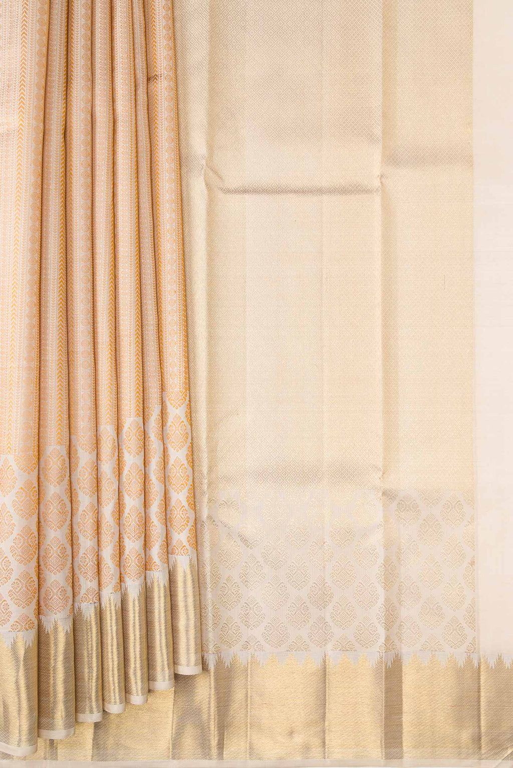 Pleats and pallu of Beige Dual Tone Kanchipuram Silk Saree with Zari Butta on the body and Zari Border. 