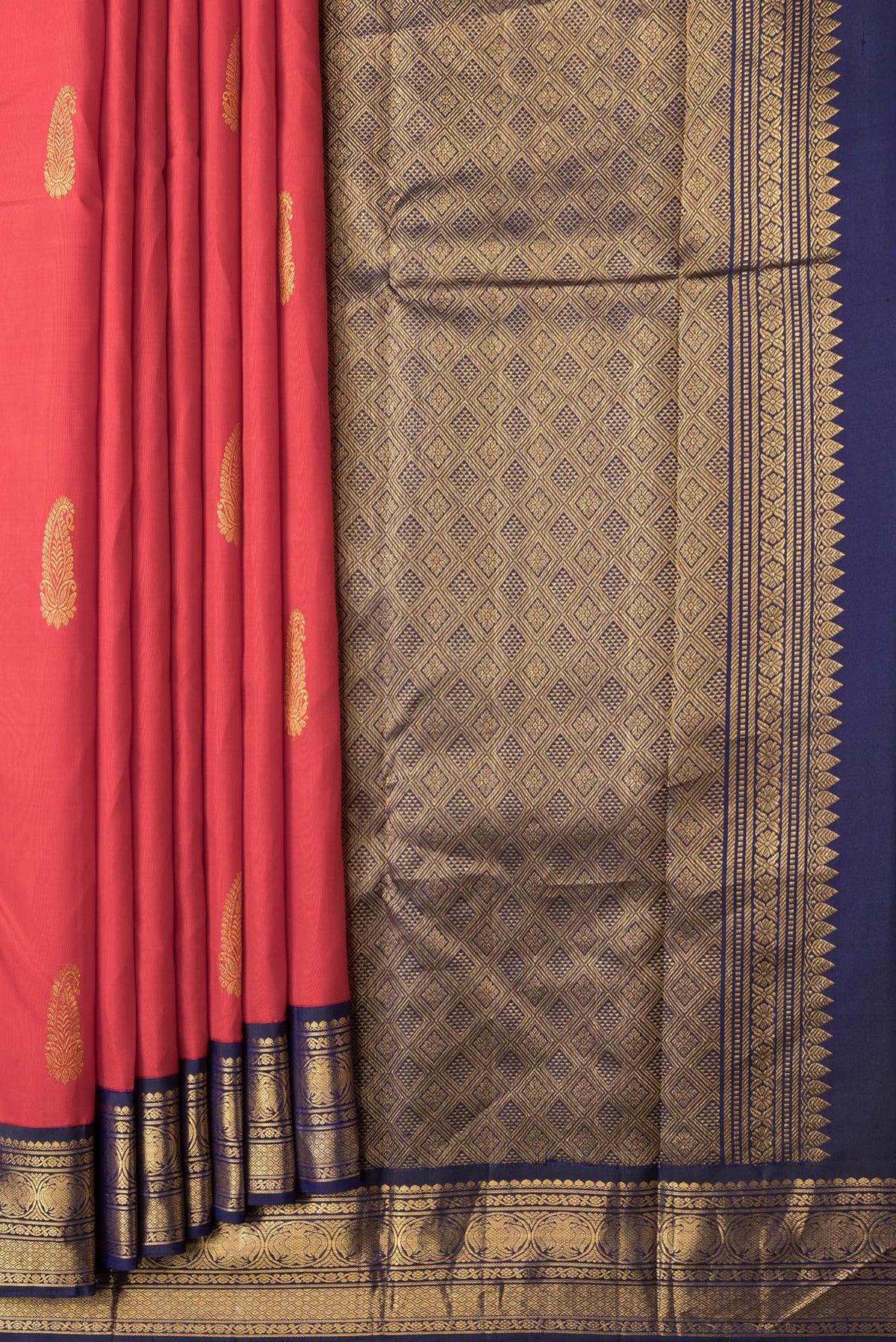 Pleats and pallu of Red Dual Tone Kanjivaram Silk Saree with Zari Butta on the body and Zari Border. 