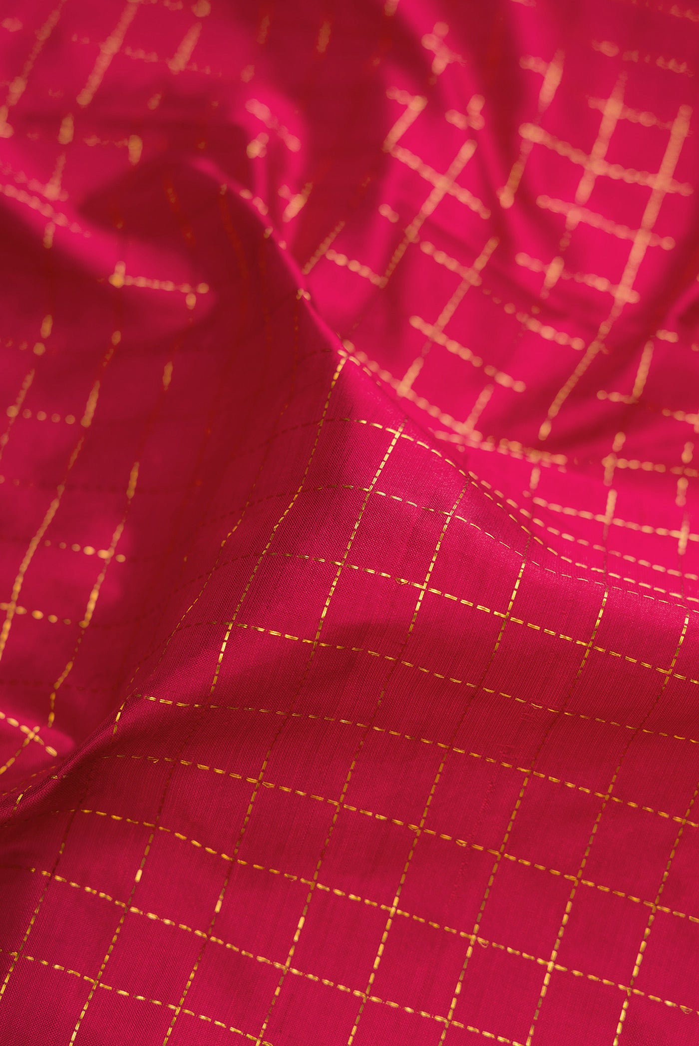Close up of Maroon Kanchipuram Silk Nine Yards Saree with Checked design on the body and Zari Border.  displaying folds