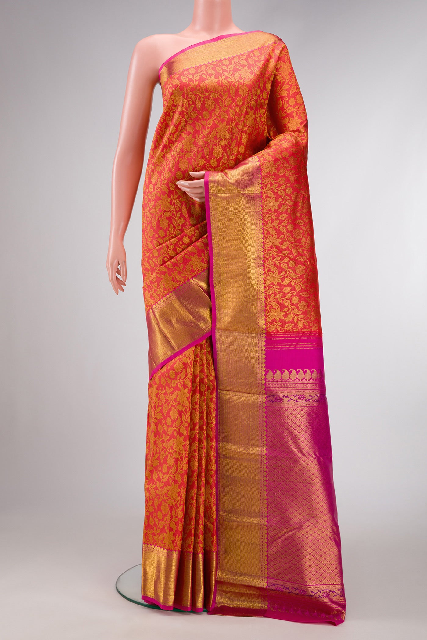 Coral Dual Tone Kanjivaram Silk Saree with Zari Brocade on the body and Zari Border.  displayed on a mannequin